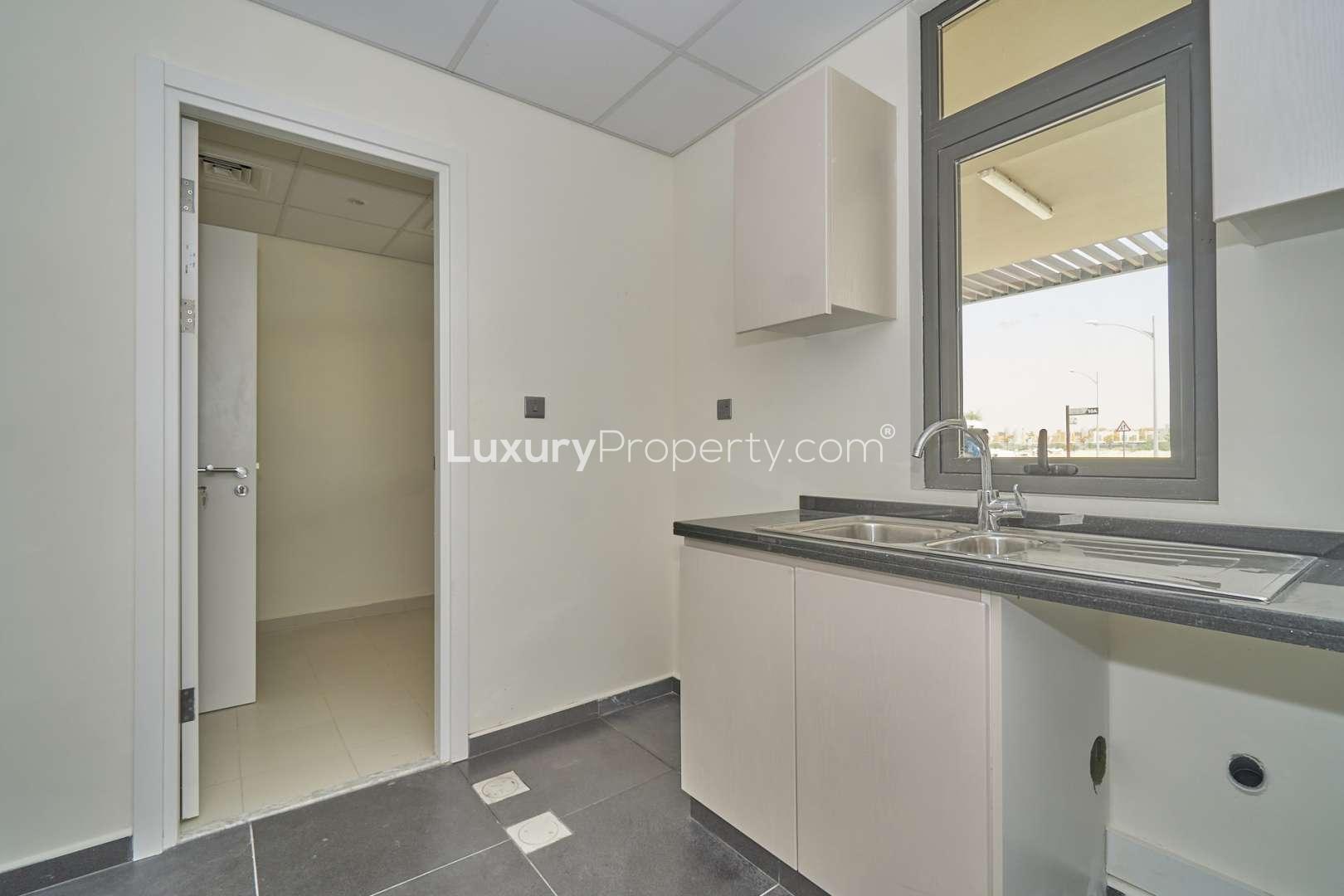 Stunning three-bedroom townhouse exterior in Primrose, Damac Hills 2, for sale