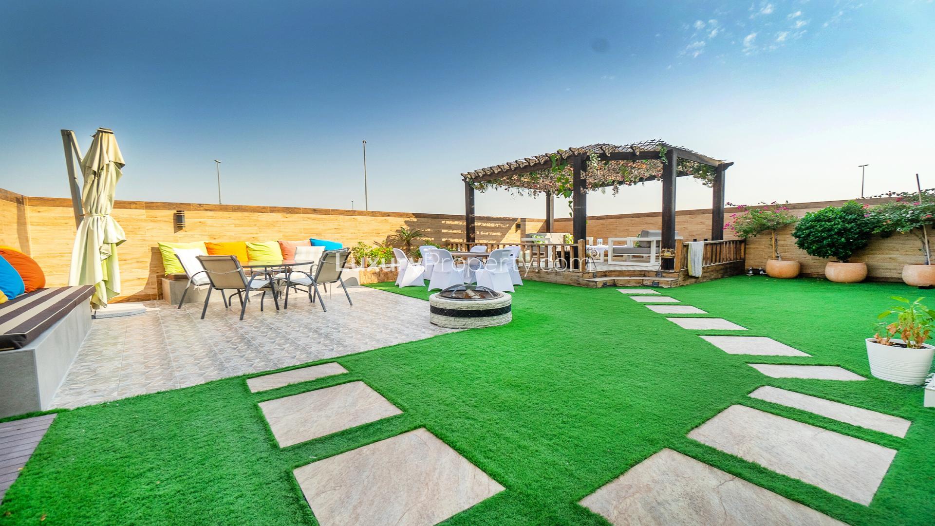 Upgraded living room in 3-bedroom townhouse, Queens Meadow, Damac Hills, featuring modern decor