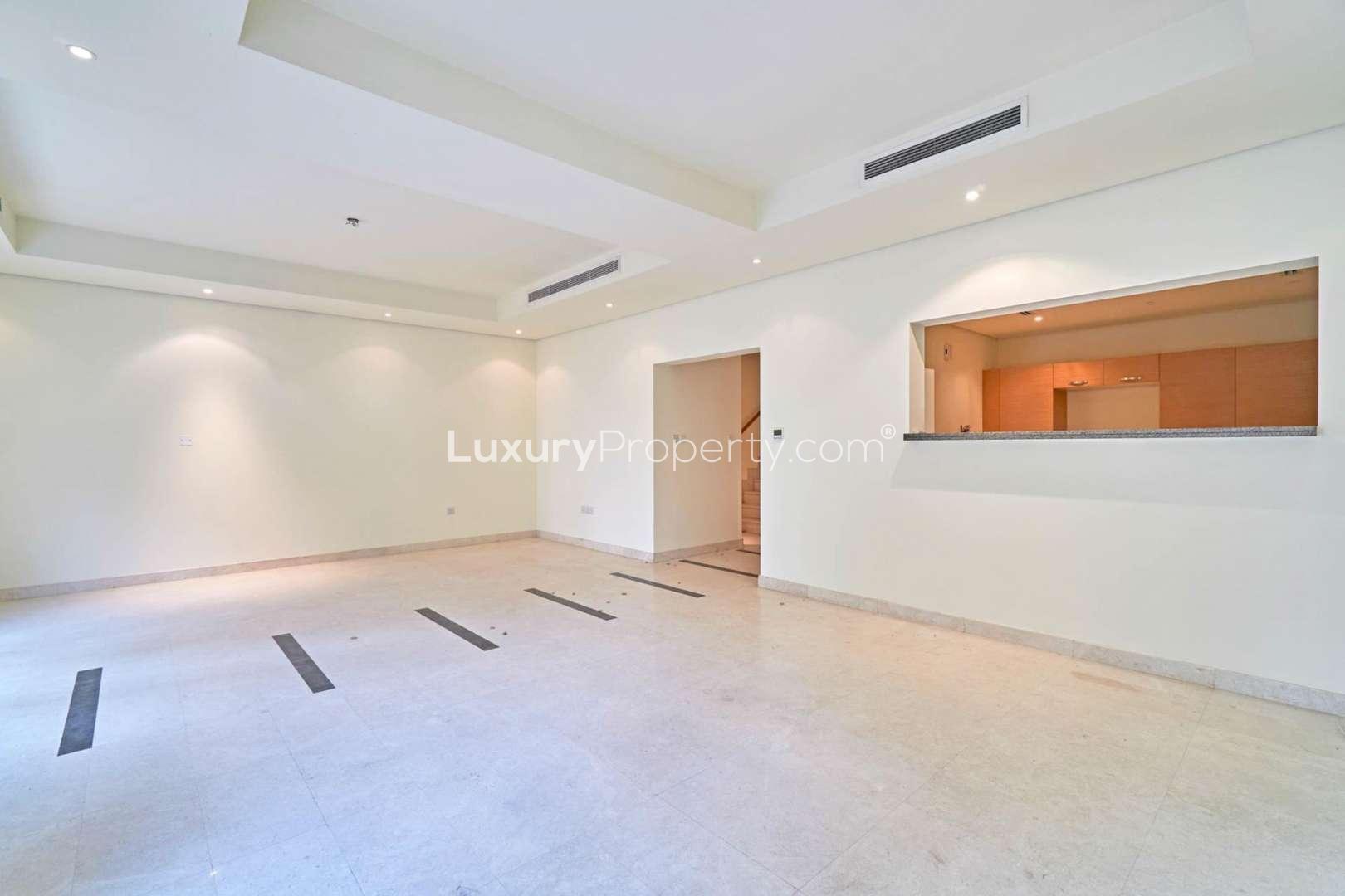 Spacious living area in Quortaj style townhouse, Al Furjan, Dubai, with large windows