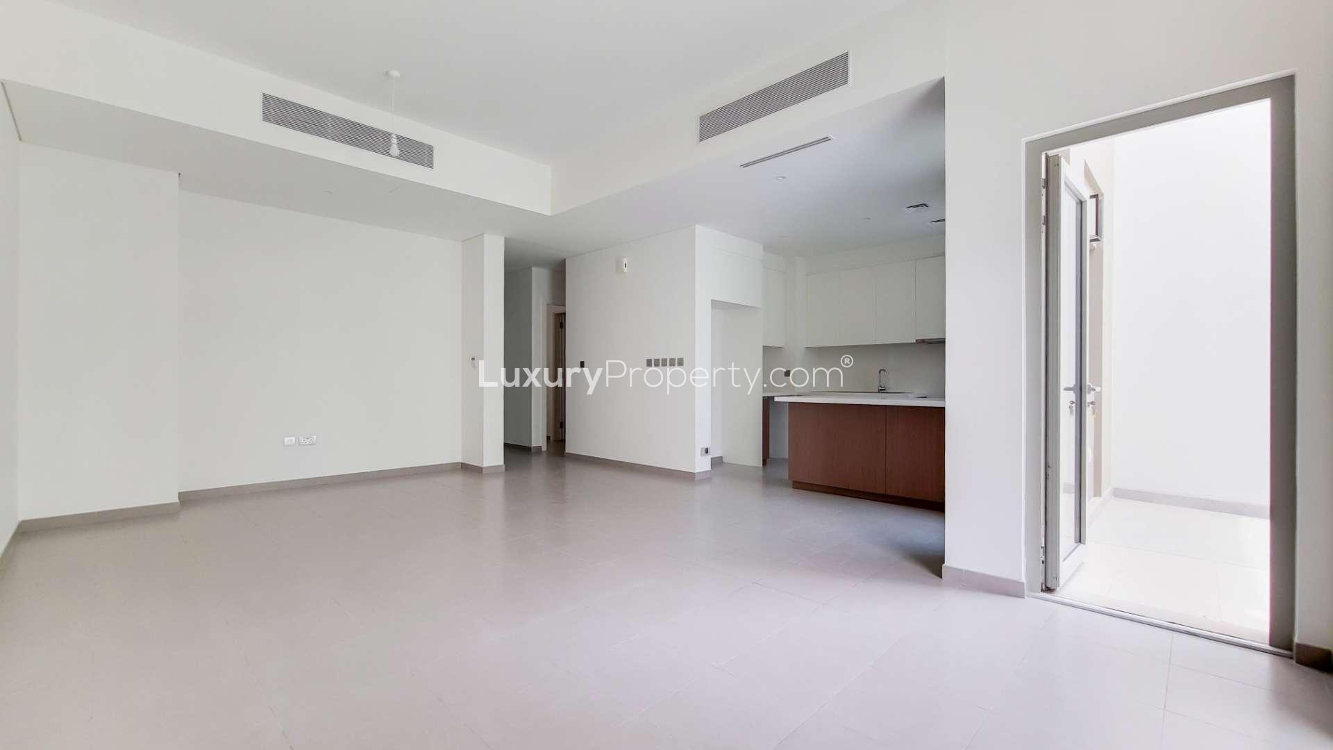 "Spacious backyard of 3-bedroom townhouse in Reem, Arabian Ranches 2, for sale.",Open-plan living area in Type 1M townhouse, Reem Community, Arabian Ranches 2