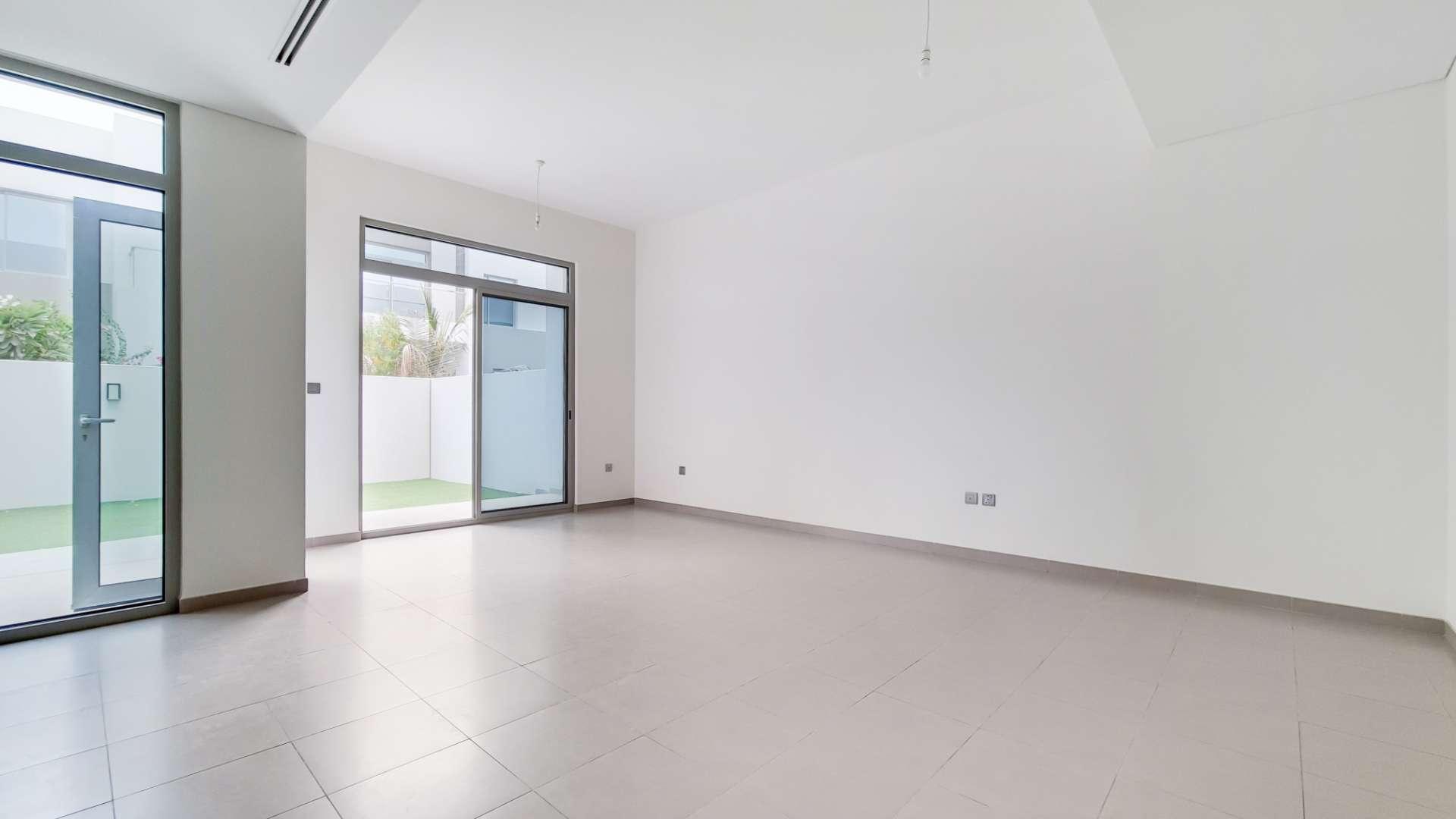 Stunning 3-bedroom townhouse exterior with green lawn in Reem, Arabian Ranches 2 for sale