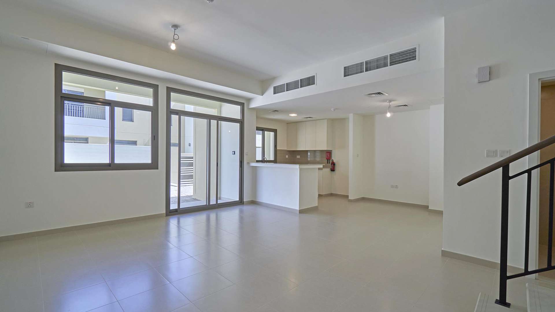 Modern 3-bedroom townhouse exterior in Sama, Town Square, for sale