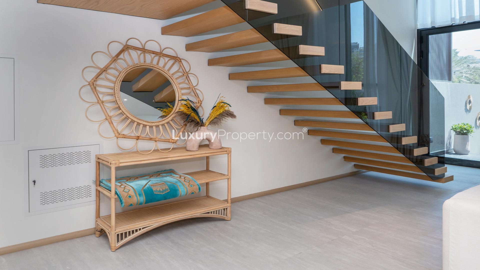 Modern kitchen and dining area in Jumeirah Village Circle townhouse for sale