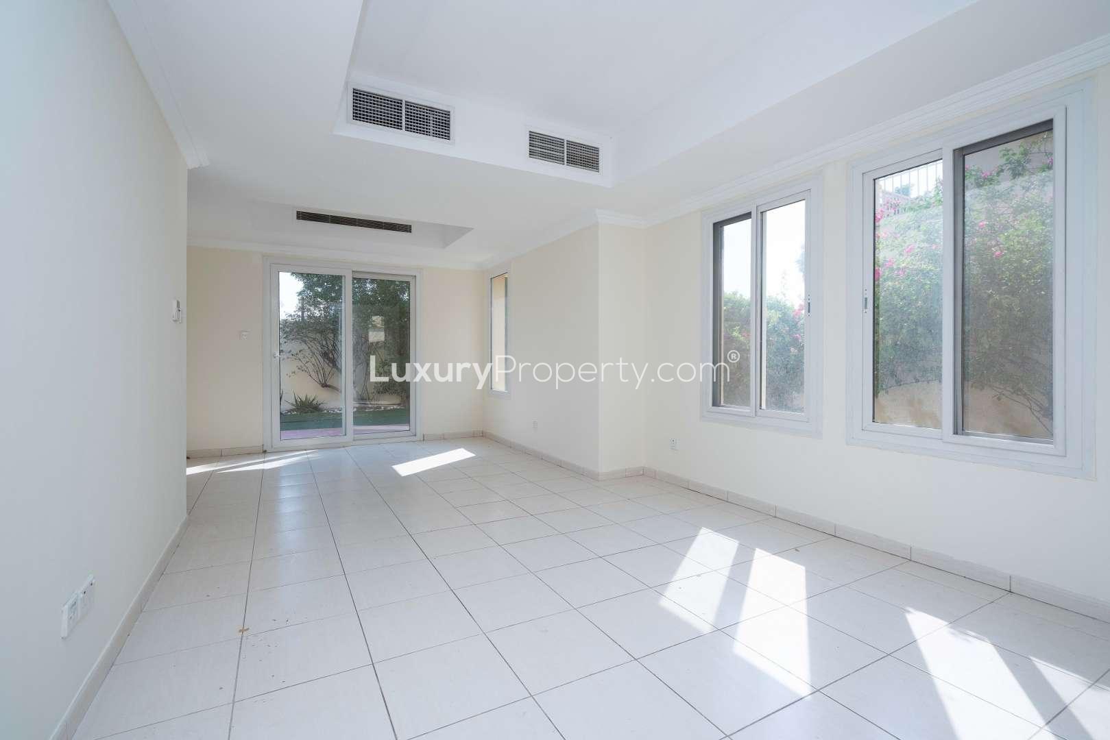 Bright living area in Springs 11 townhouse, tiled floors, open access to kitchen
