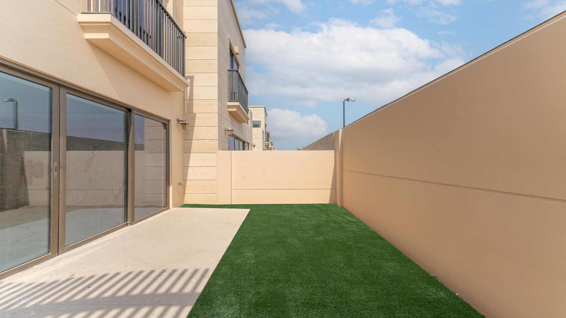 Brand new modern kitchen in Jumeirah Golf Estates townhouse, featuring marble flooring and countertops