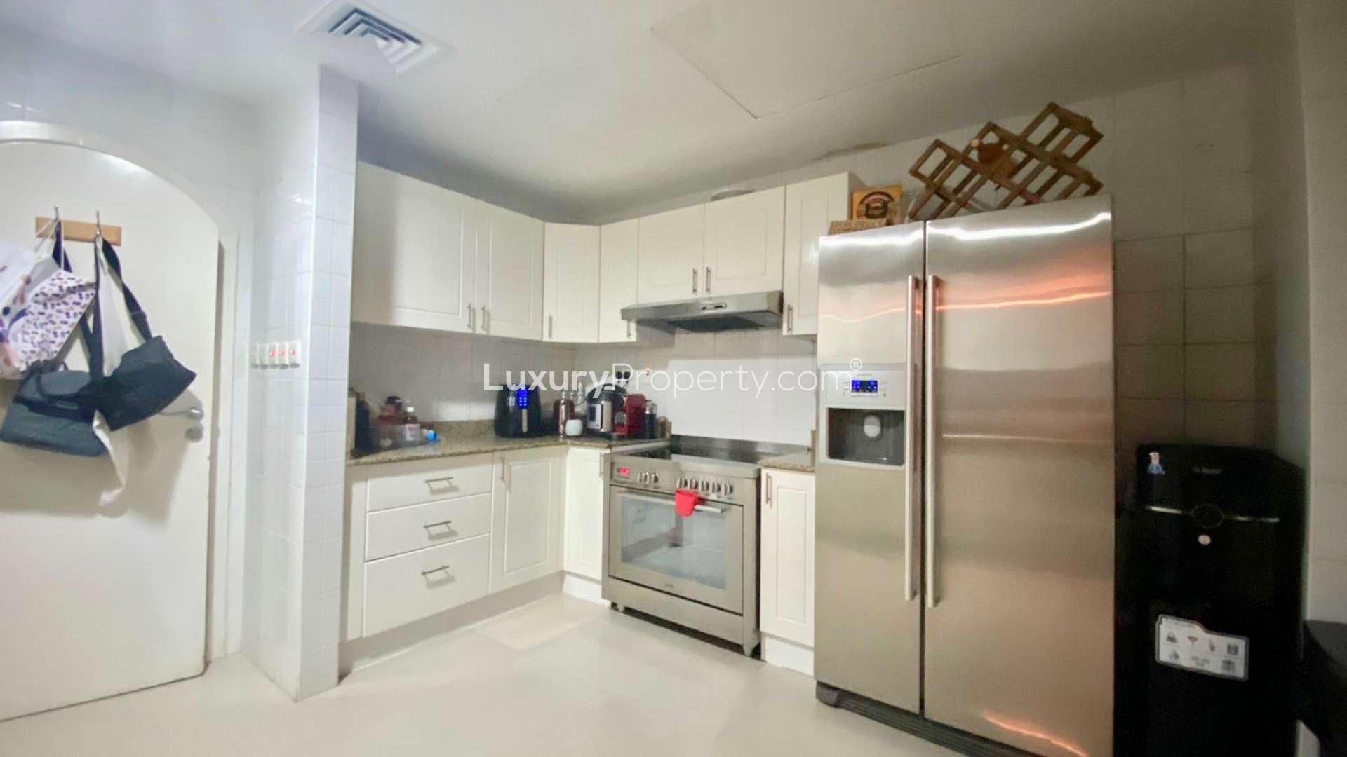Modern kitchen in Springs 12 townhouse, featuring sleek cabinetry and ample counter space