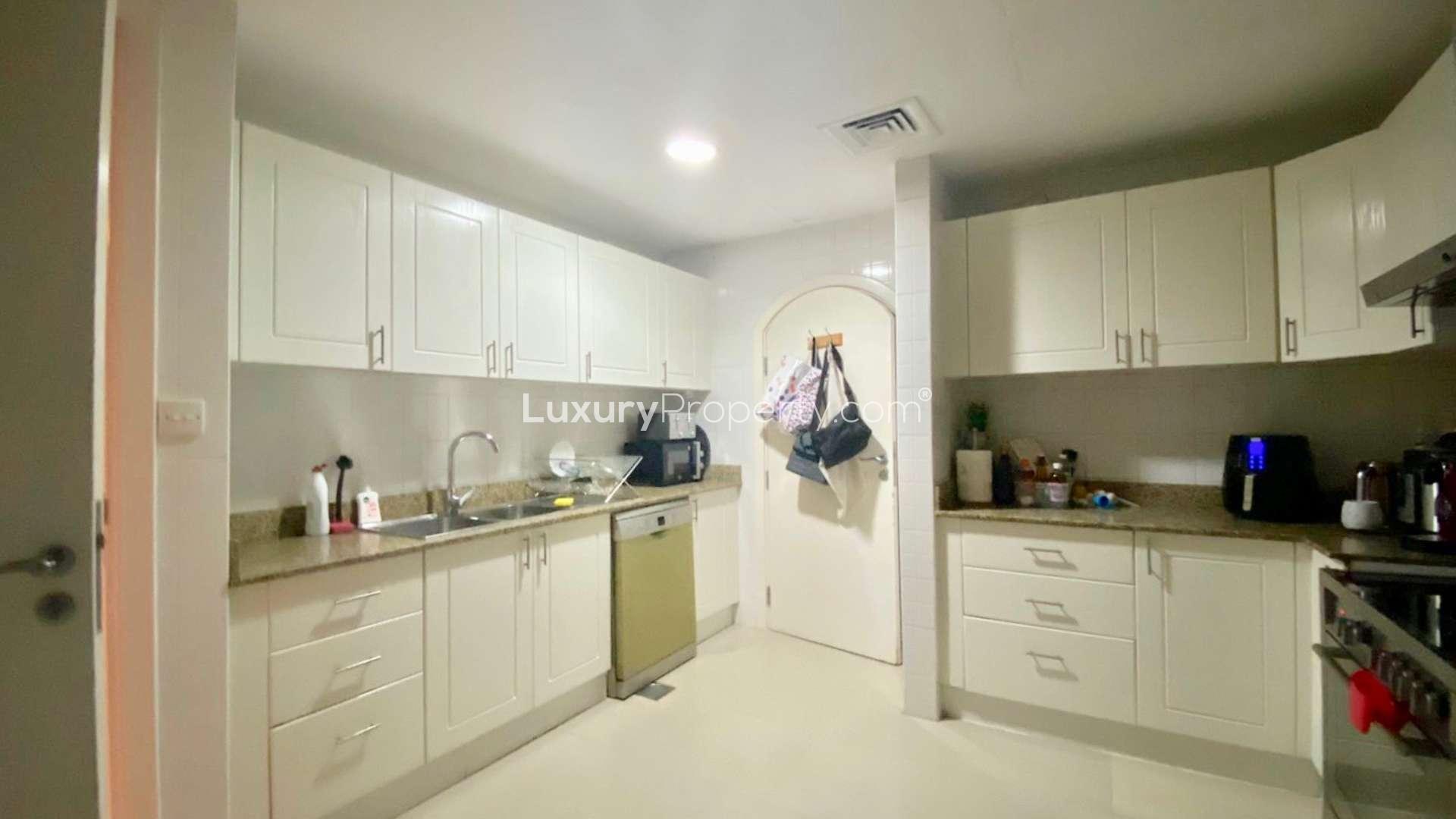 Living room in Springs 12 townhouse for sale, featuring modern decor and cozy seating