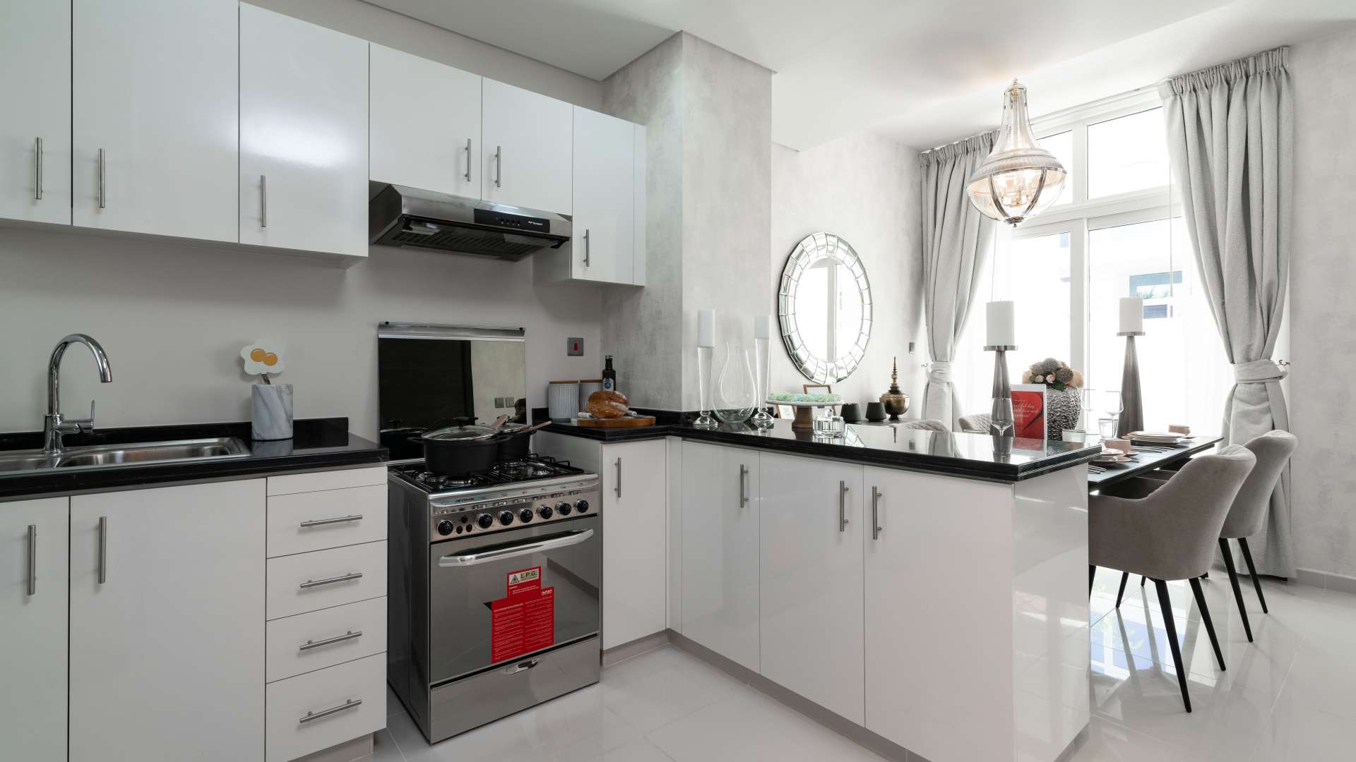 Modern living and dining area in Akoya Oxygen townhouse, featuring elegant decor and TV