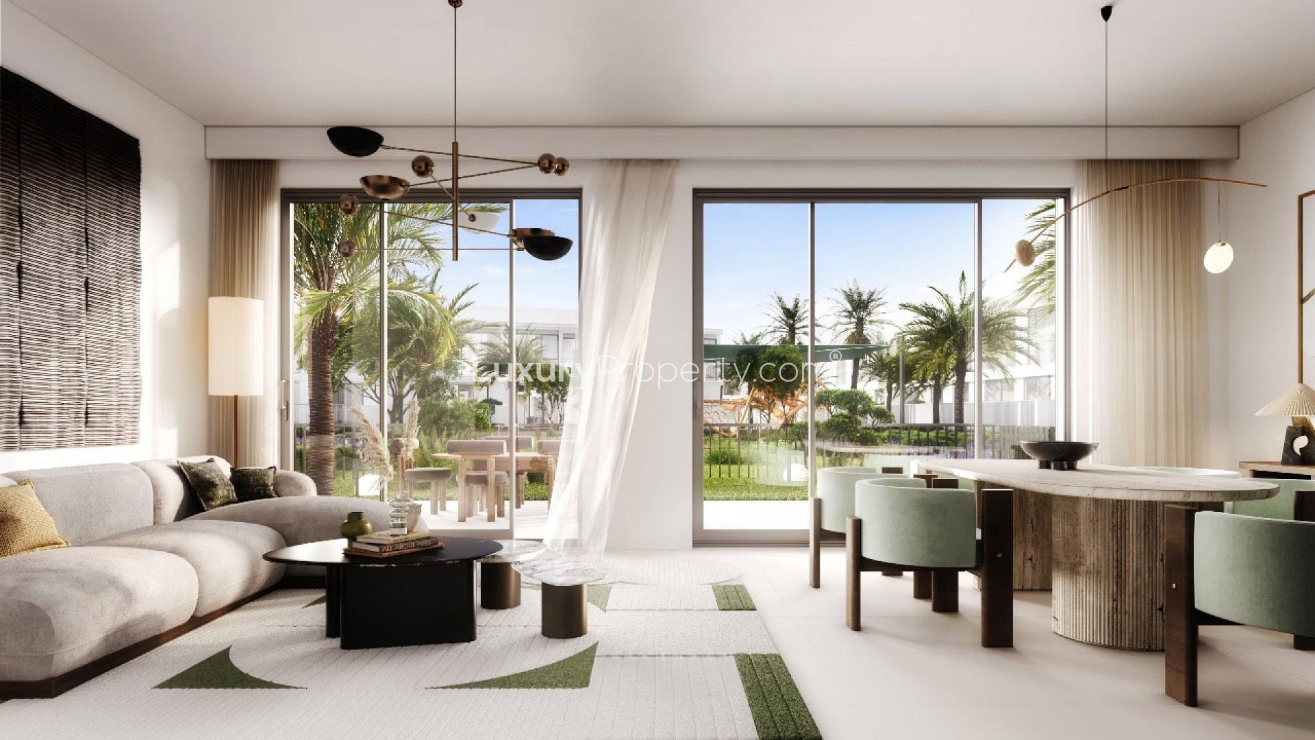 Modern living room in 3-bedroom townhouse, Greenridge, Emaar South, featuring stylish decor and greenery