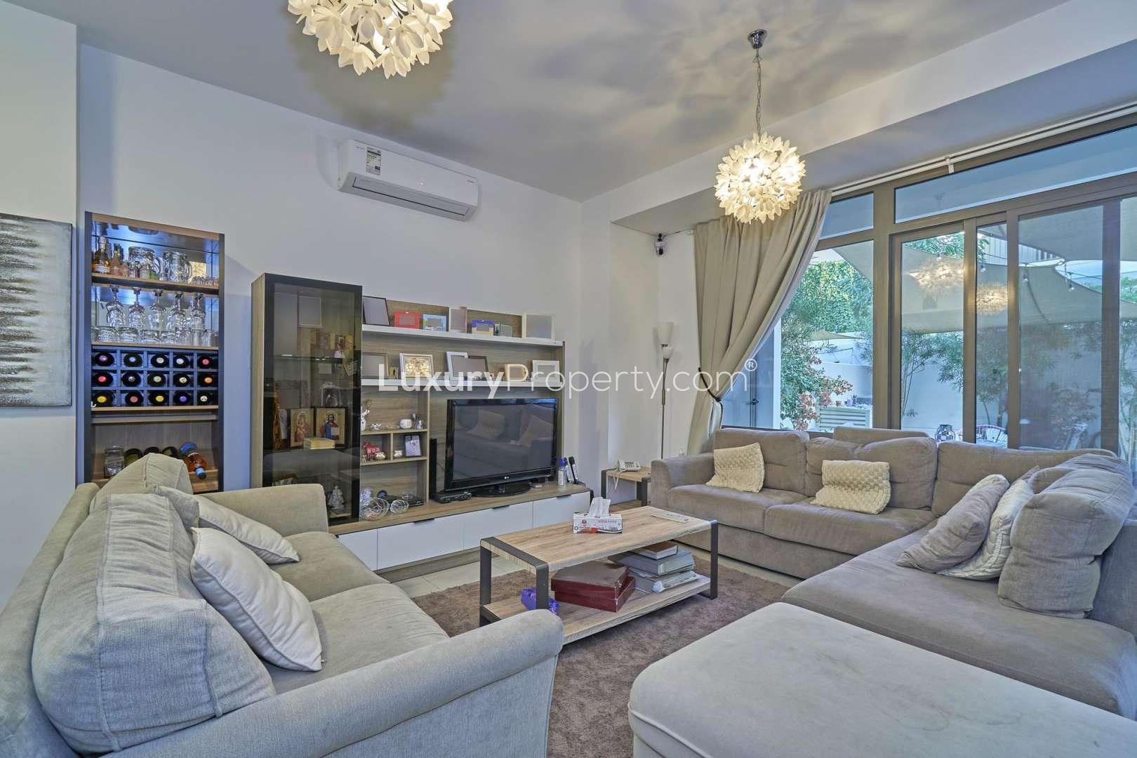 Contemporary living room in Zahra Townhouse, Town Square, with modern decor and cozy seating