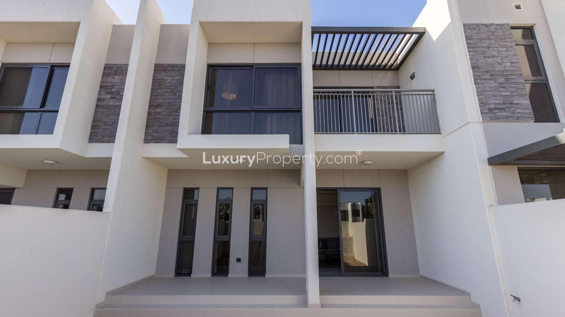 Modern staircase and hallway in Zinnia townhouse, Damac Hills 2, showcasing spacious interior