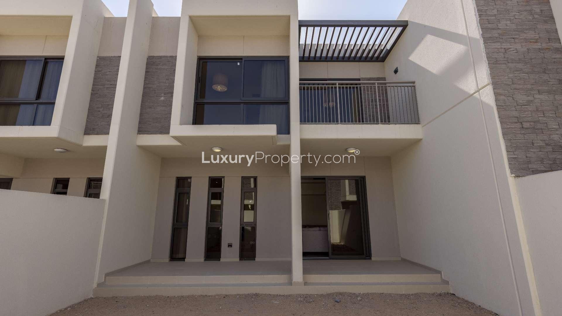 Contemporary living room in 3-bedroom townhouse, Zinnia, Damac Hills 2, with large windows