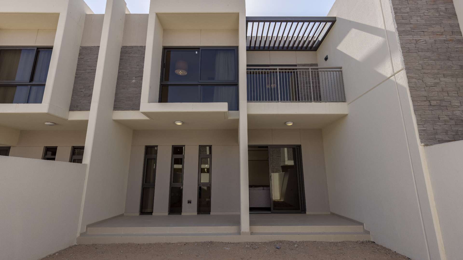 Contemporary living room in 3-bedroom townhouse, Zinnia, Damac Hills 2, with large windows