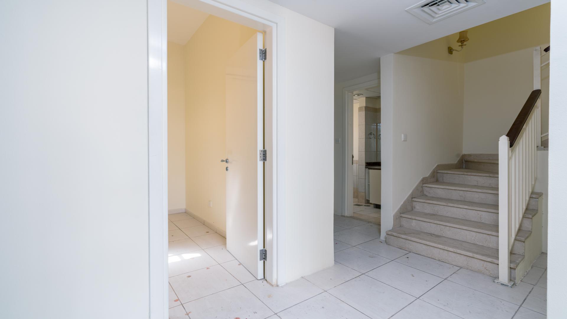 N/A,"Interior view of 2-bedroom villa entryway and staircase in Springs 4, Emirates Living.",Empty living room in 2-bedroom villa, Springs 4, Emirates Living, for rent