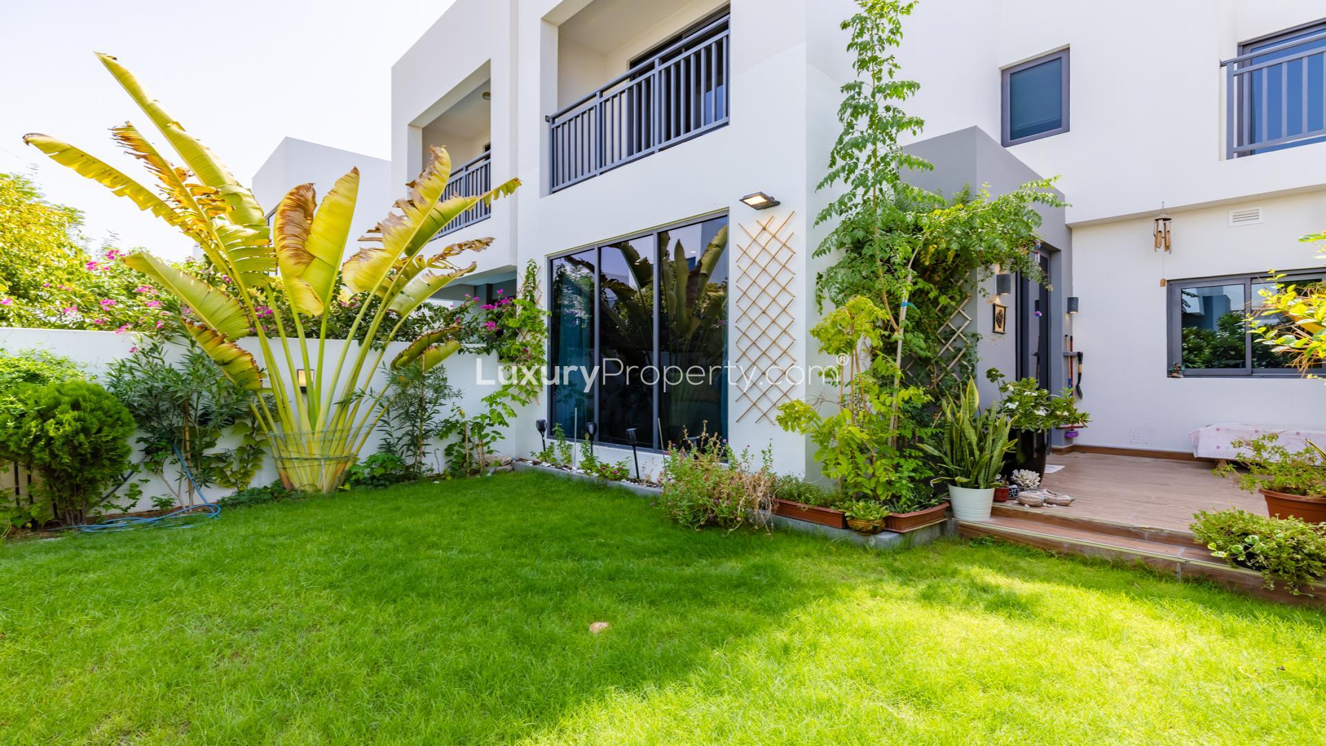 Living room in modern villa, Dubai Hills Estate, with garden views and elegant decor