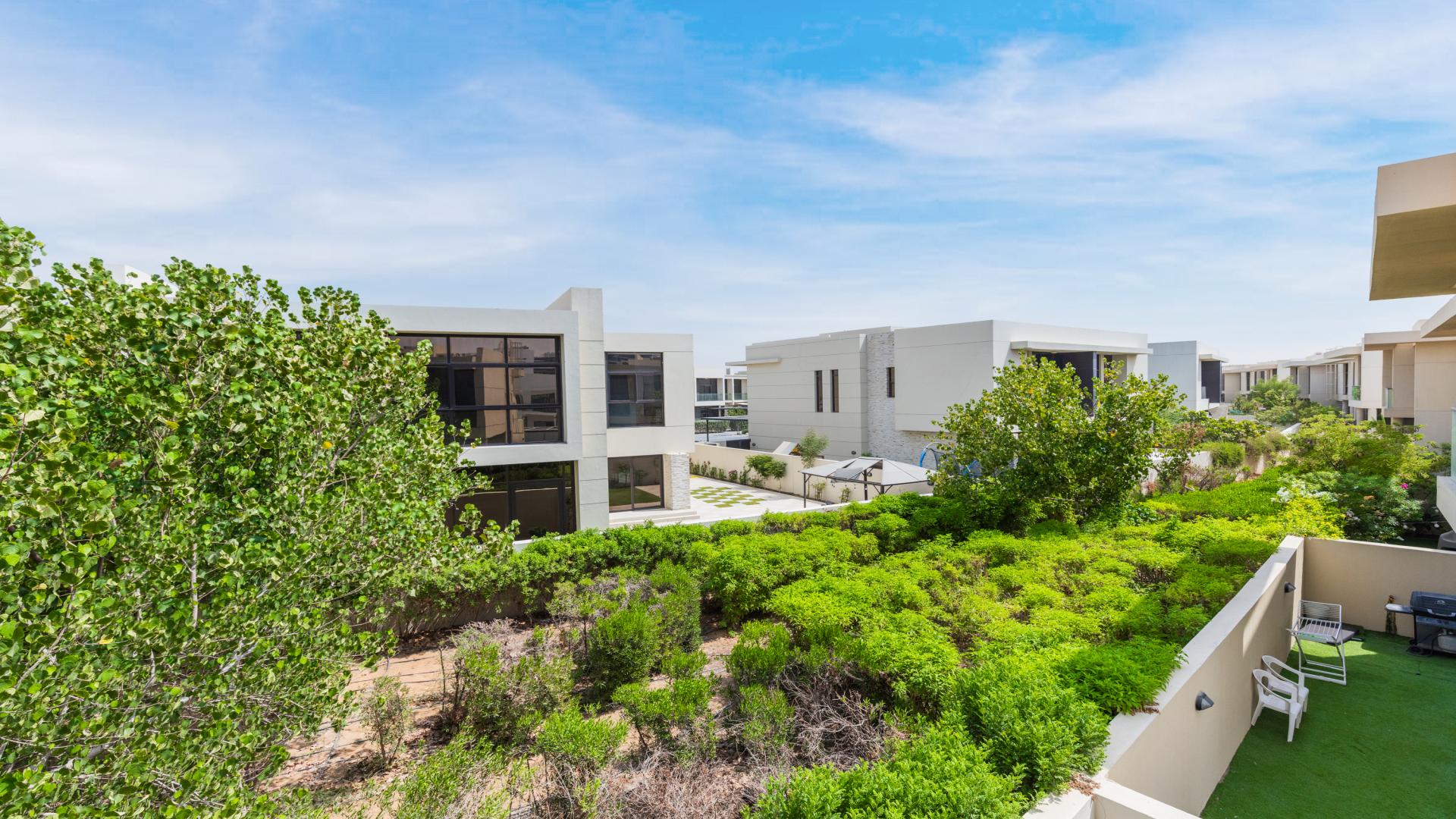 Luxurious villa balcony view in Damac Hills' Phoenix community with modern architecture