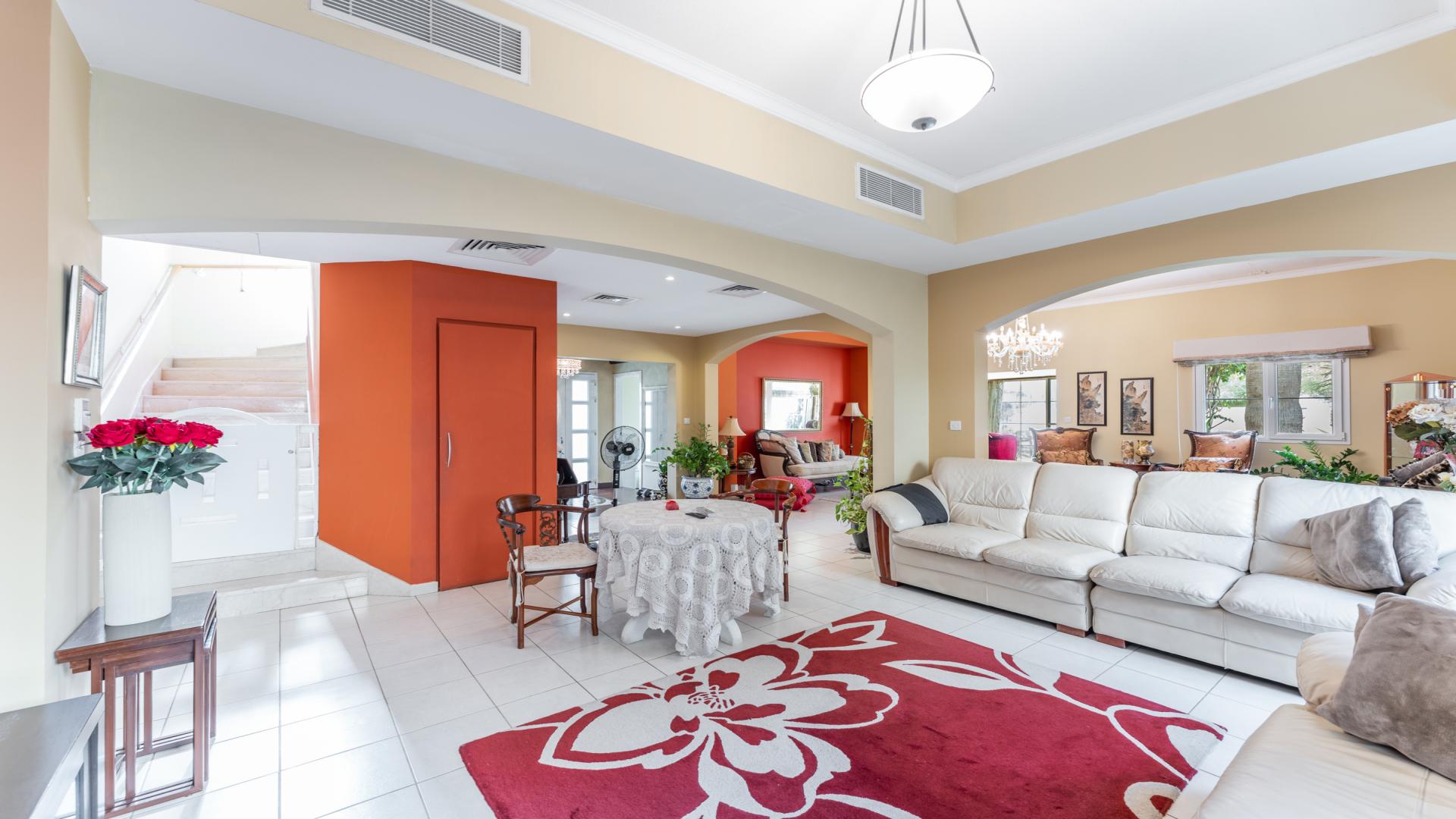 Spacious living room in upgraded Meadows 1 villa, featuring elegant decor and natural light