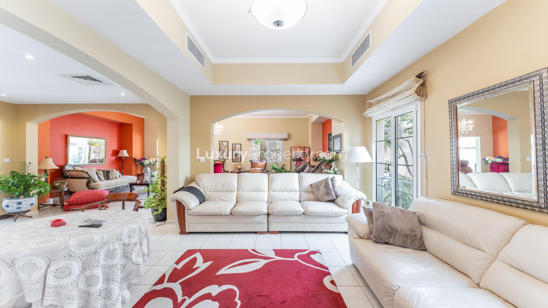 "Balcony view of lush garden and skyline in Meadows 1 villa for rent, LP39062.",Spacious living room in upgraded Meadows 1 villa with elegant decor and natural light