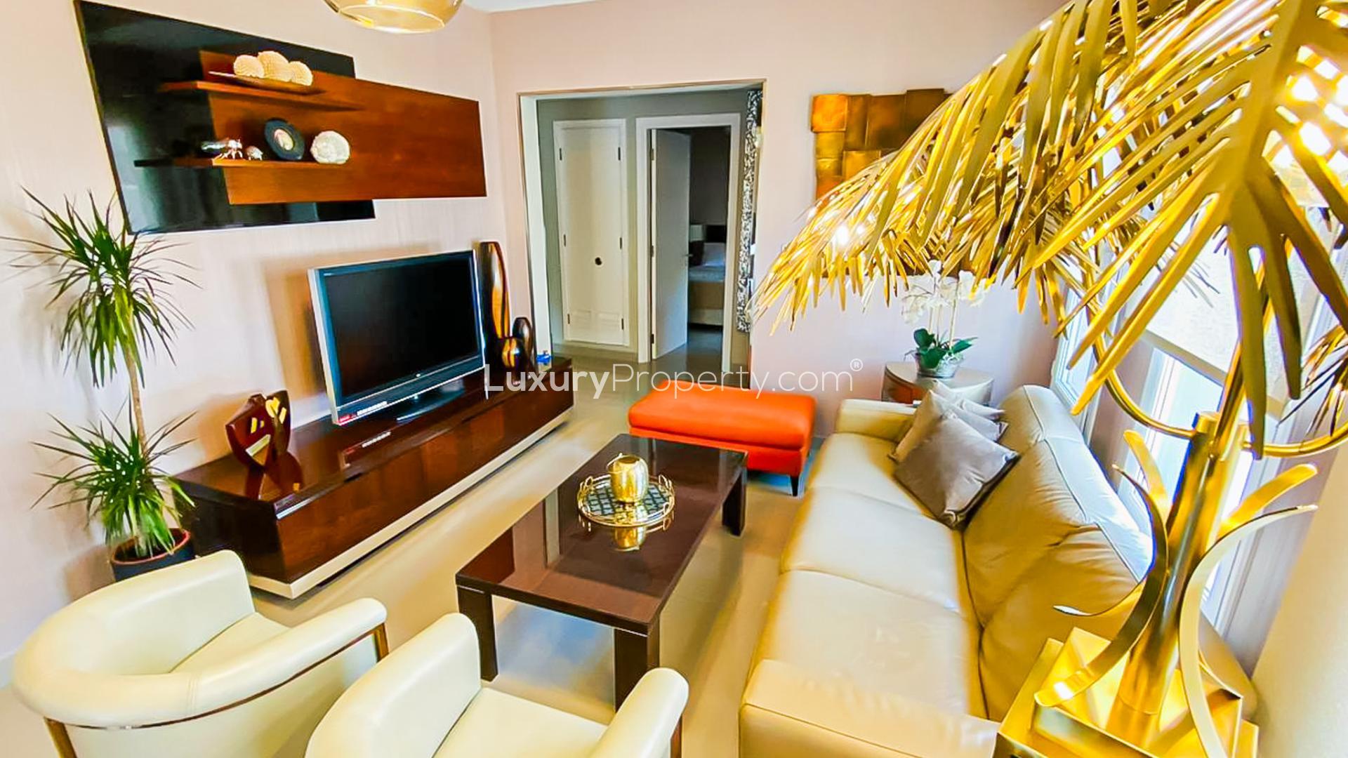 Stylish villa patio with wicker furniture overlooking a private pool in Springs 14