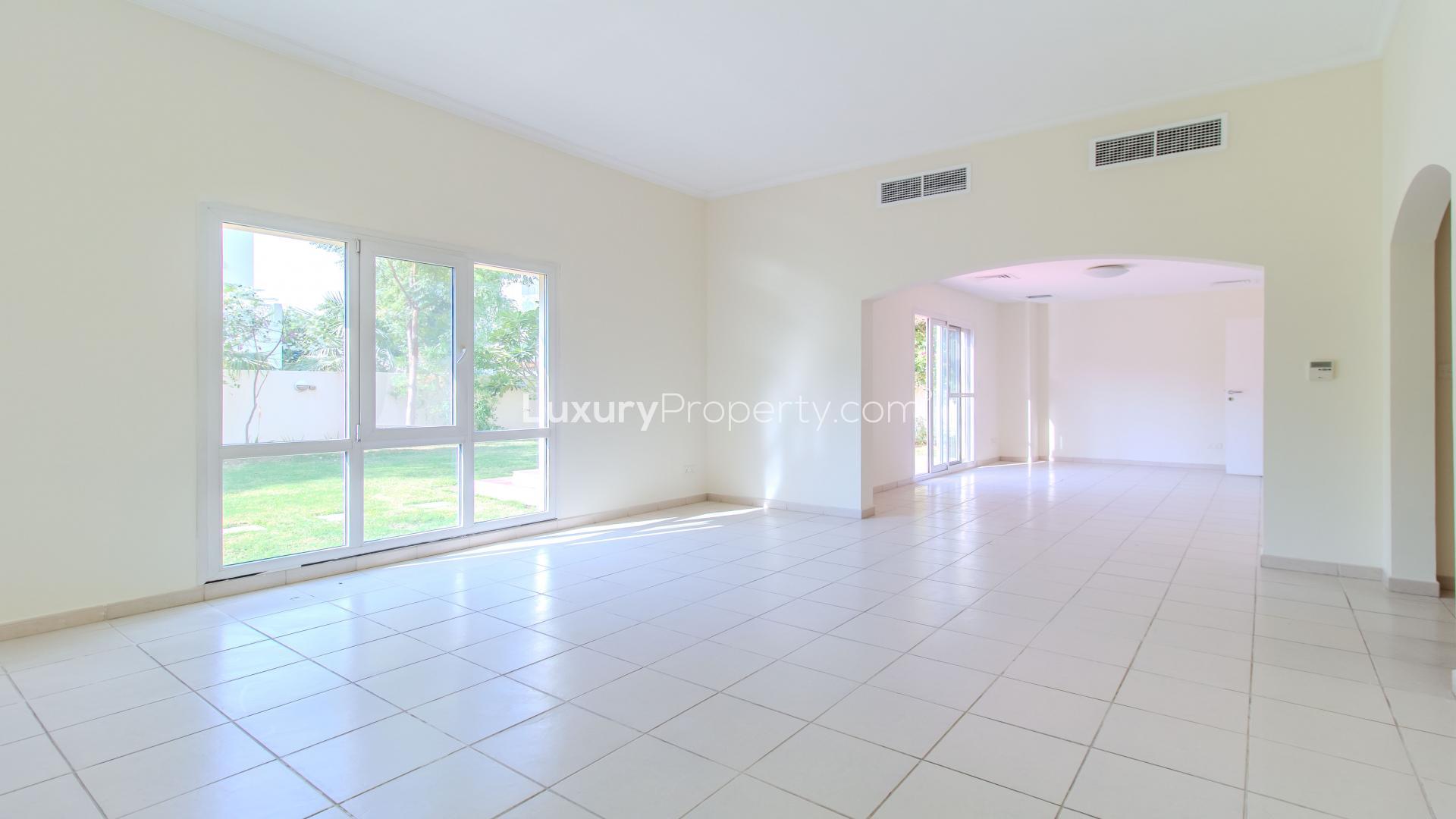 Luxurious 3-bedroom villa exterior with lush garden in Meadows 9, available for rent