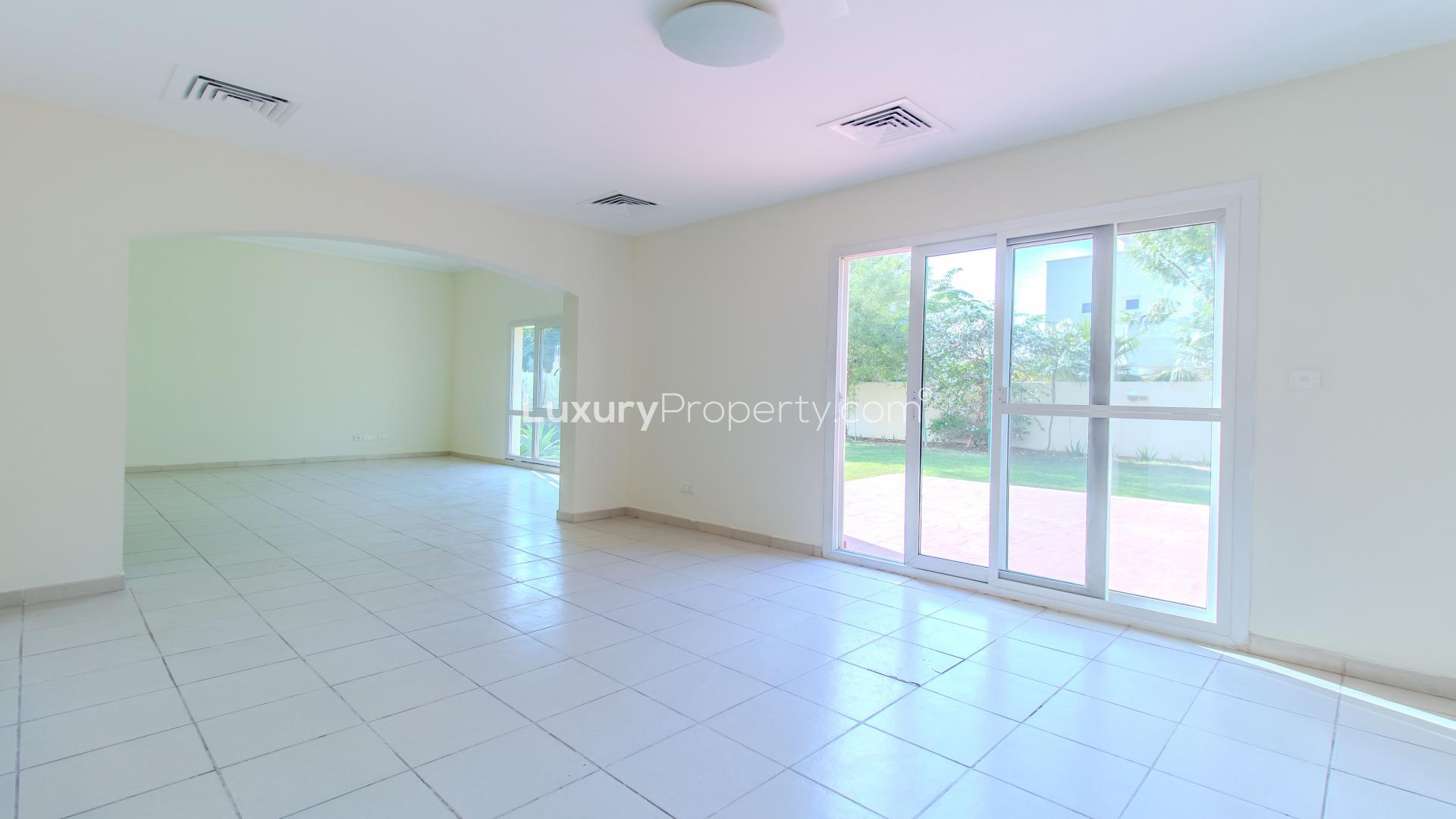 Bright, spacious living area in luxurious Meadows 9 villa with garden view