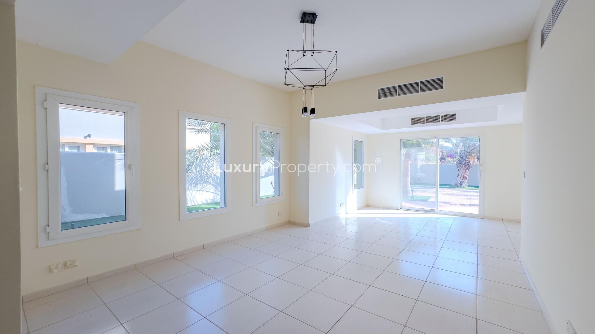 Spacious 3-bedroom villa exterior with garden in Springs 14, available for rent
