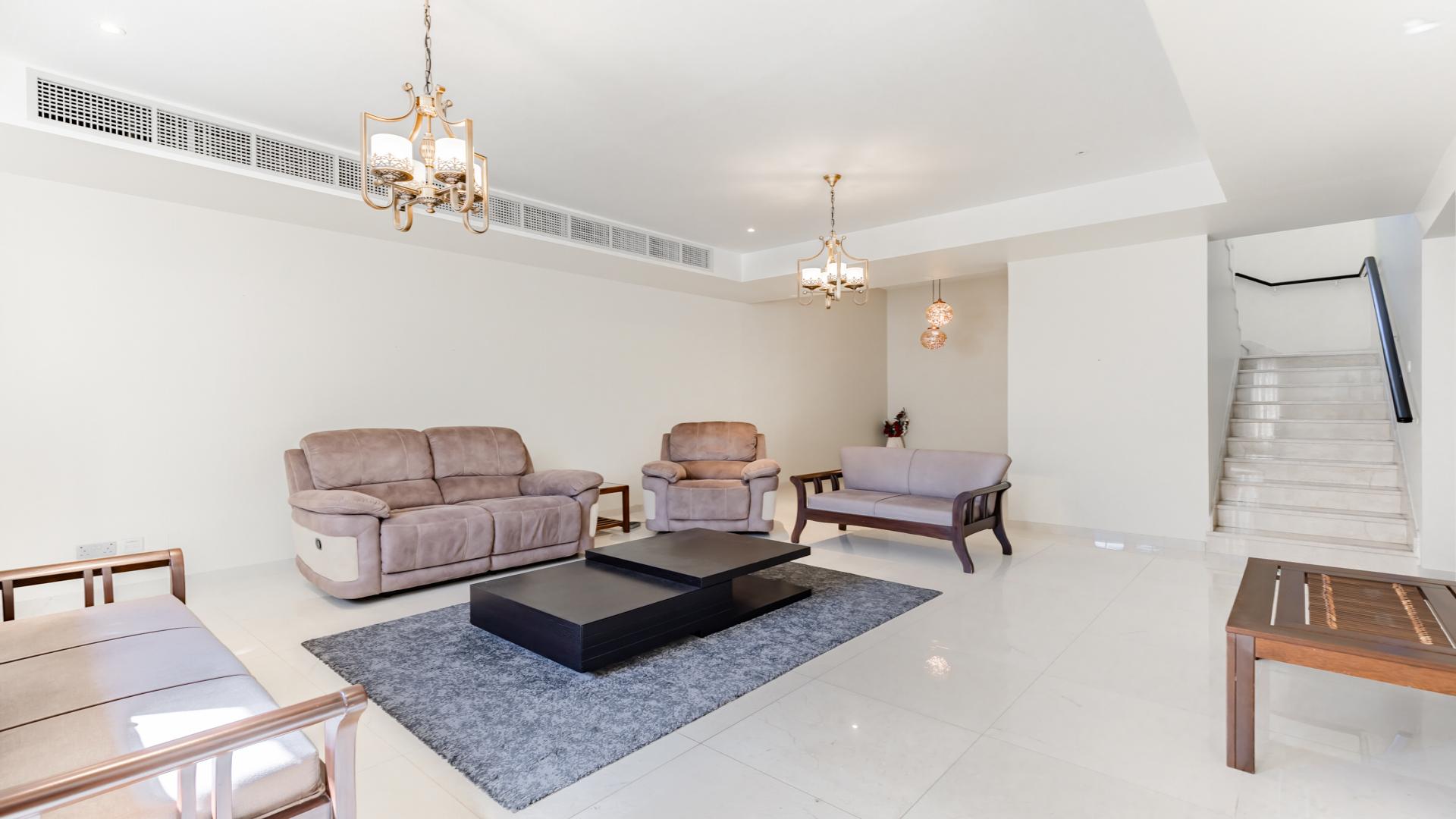 Living room of upgraded 3-bedroom villa in The Springs, featuring elegant furnishings