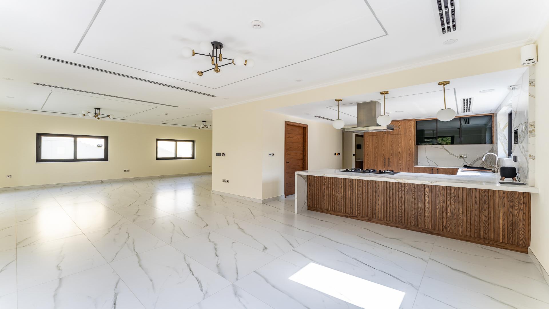 Modern kitchen in upgraded 3-bed Legacy Villa, Jumeirah Park, with garden view
