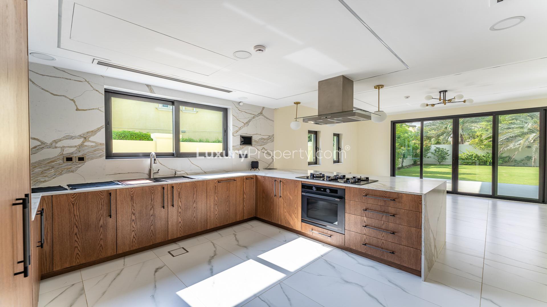 Spacious living area in upgraded 3-bed Legacy Villa, Jumeirah Park, with garden view