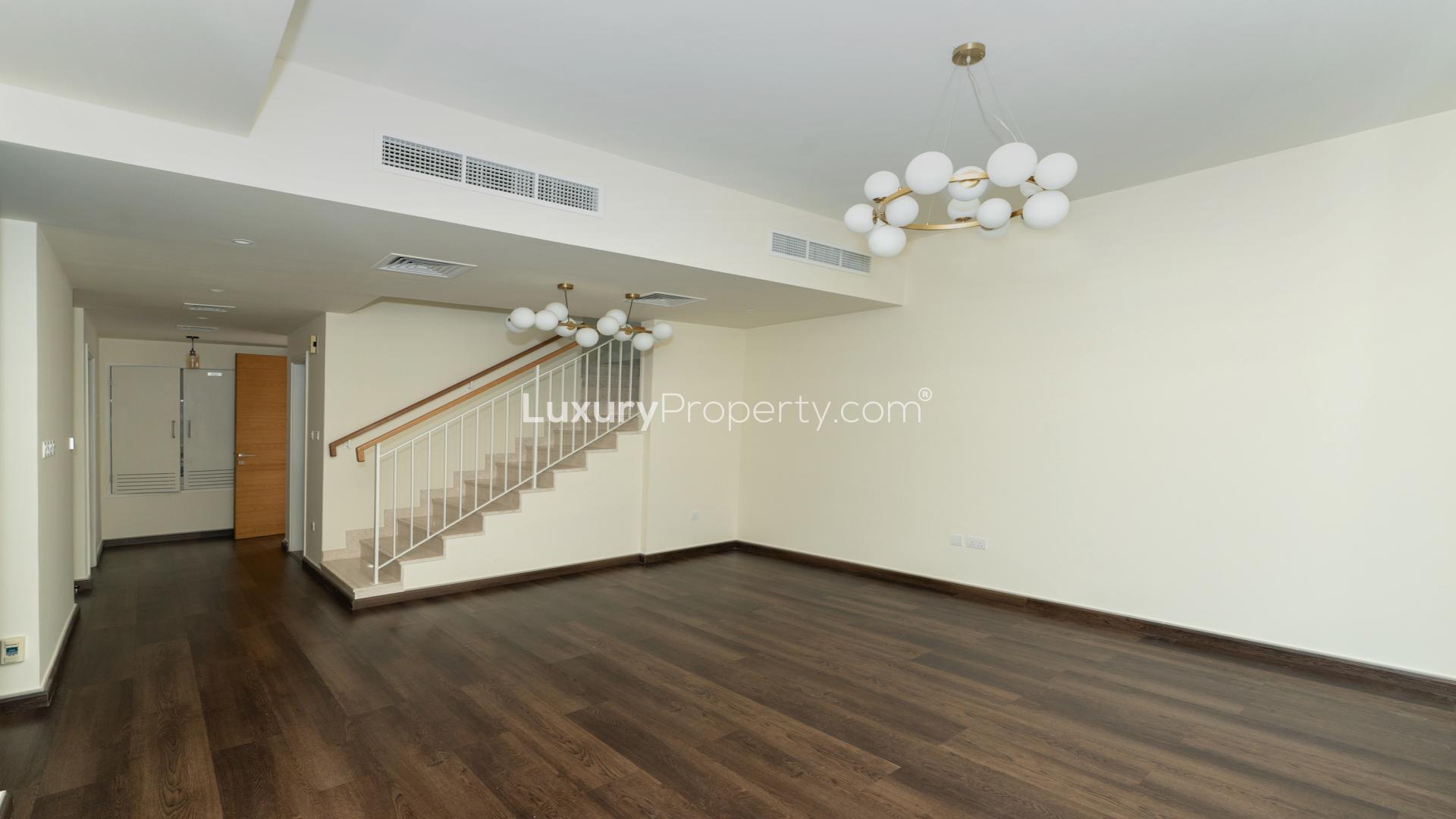 Spacious living area with modern lighting in Dubai Hills Estate villa for rent, Maple 3