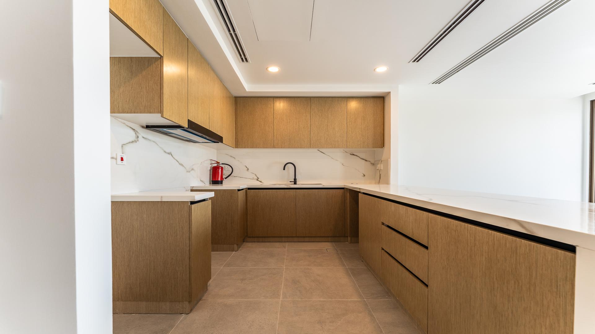 Spacious modern kitchen and living area in La Violeta villa, Villanova community