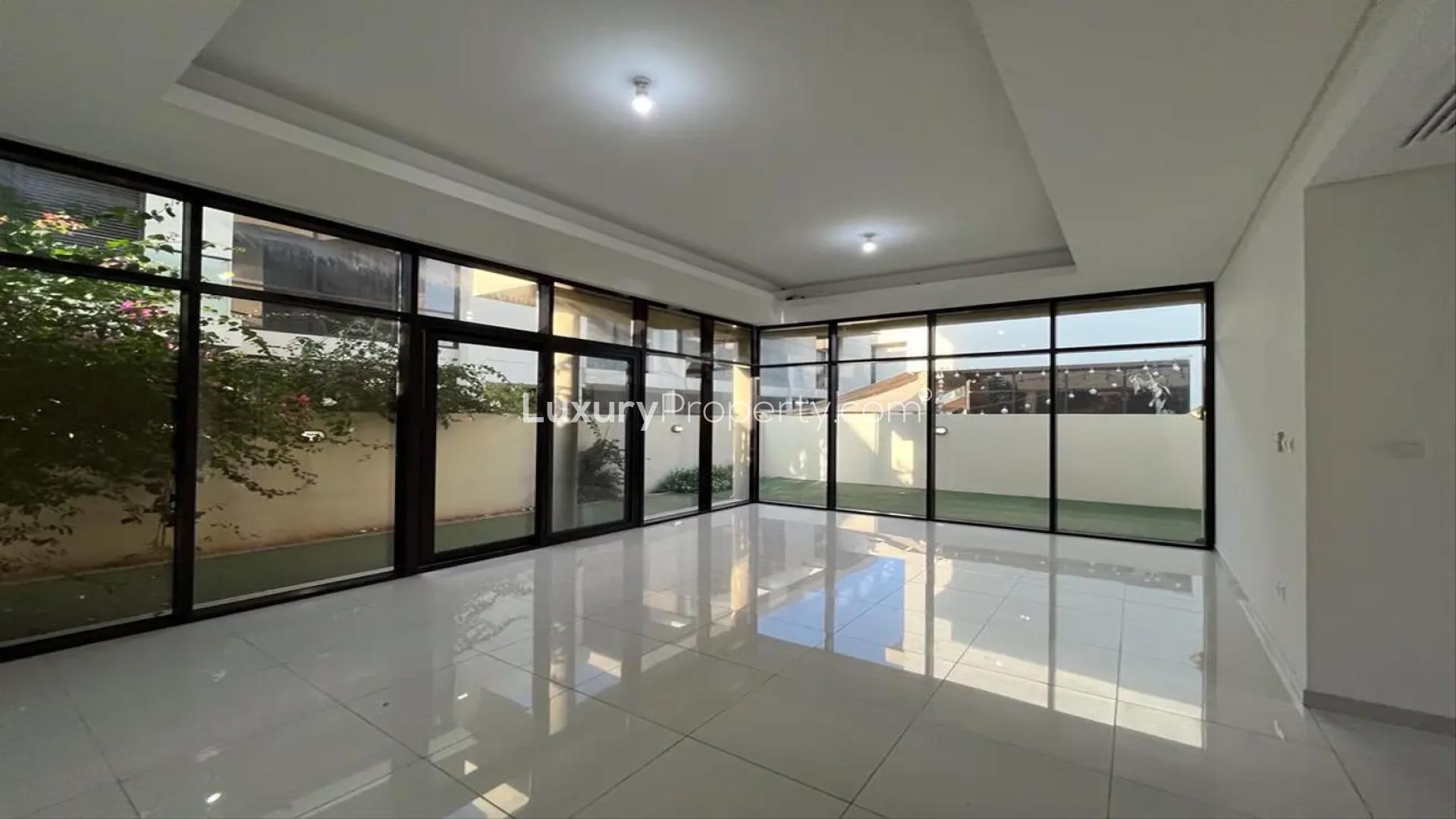 Semi-detached villa backyard with artificial grass in Richmond, Damac Hills