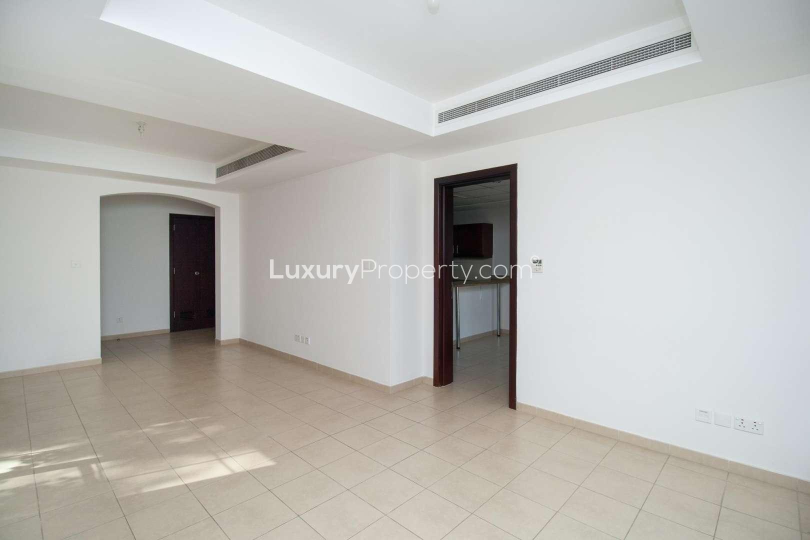 Spacious living room with large windows in Arabian Ranches 3-bedroom villa for rent