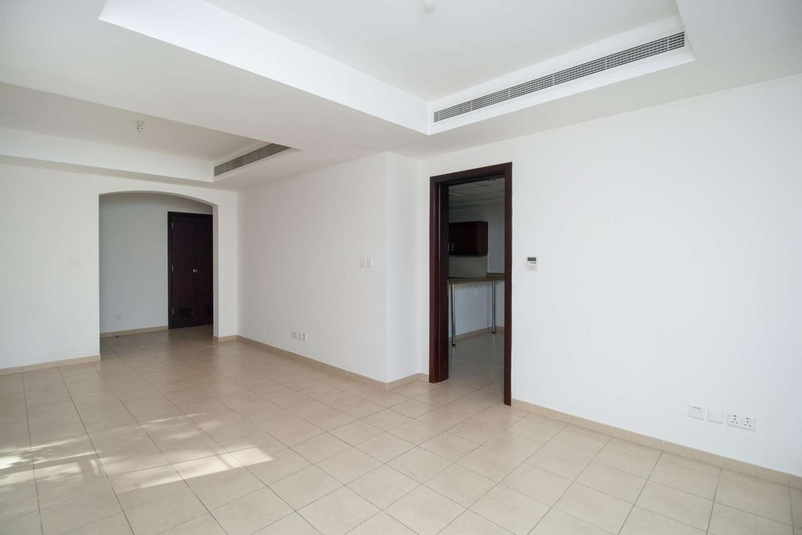 Spacious living room with large windows in Arabian Ranches 3-bedroom villa for rent