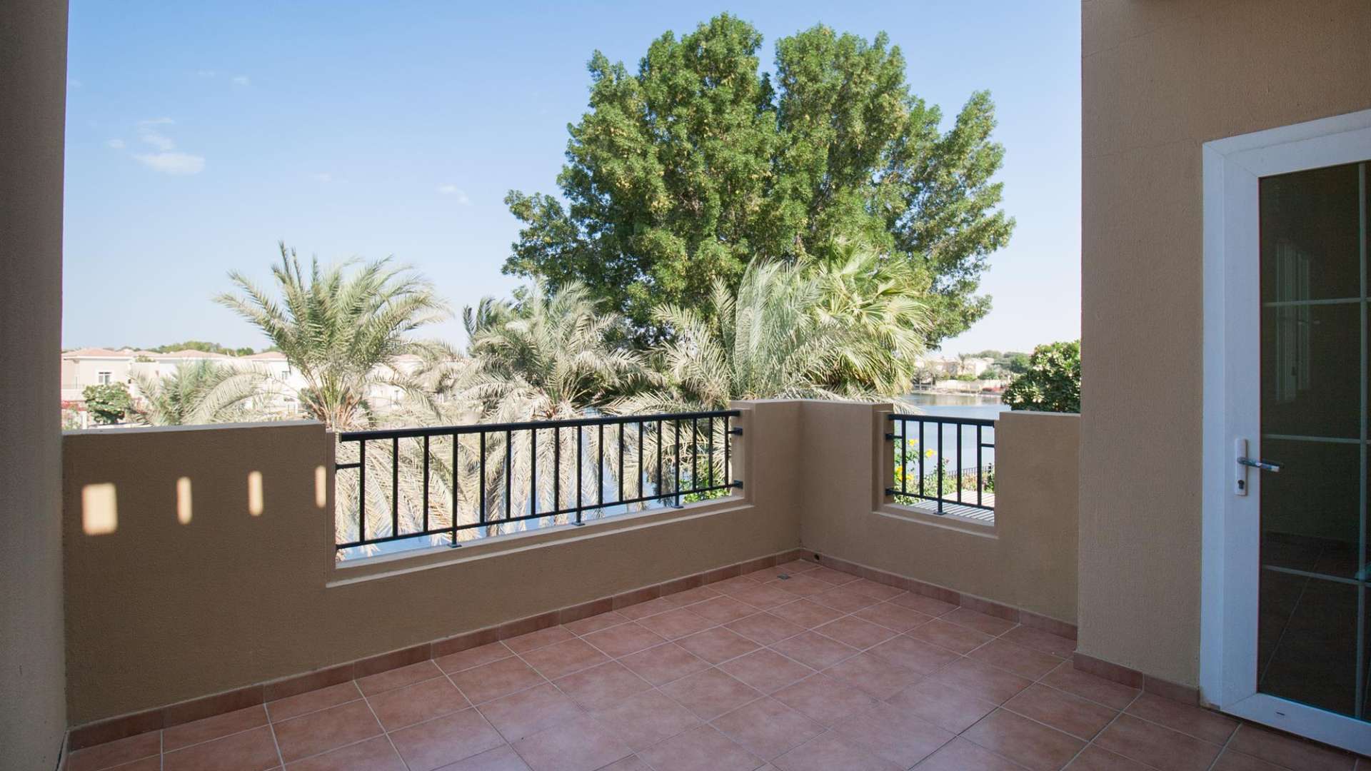 "Scenic garden view from three-bedroom villa in Al Reem 2, Arabian Ranches, for rent.","Spacious balcony view of lush greenery, Al Reem 2 villa, Arabian Ranches, three-bedroom rental.",Modern kitchen in three-bedroom villa for rent, Al Reem 2, Arabian Ranches