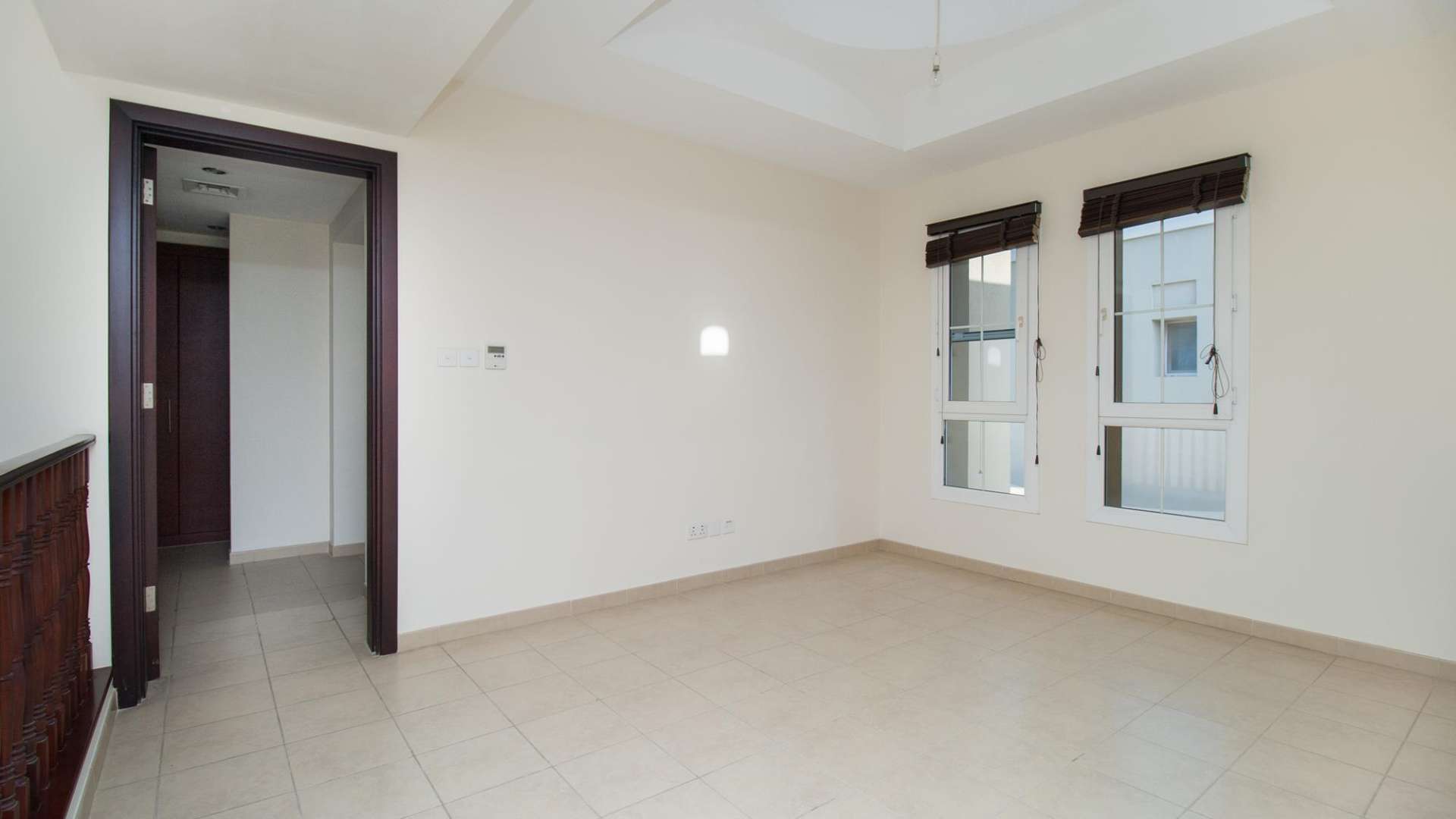 "Scenic view from 3-bedroom townhouse in Al Reem, Arabian Ranches, lush greenery and pathway.","Bright room with windows in 3-bedroom townhouse, Al Reem, Arabian Ranches, for rent.",Spacious living area in 3-bedroom townhouse, Al Reem, Arabian Ranches, available for rent