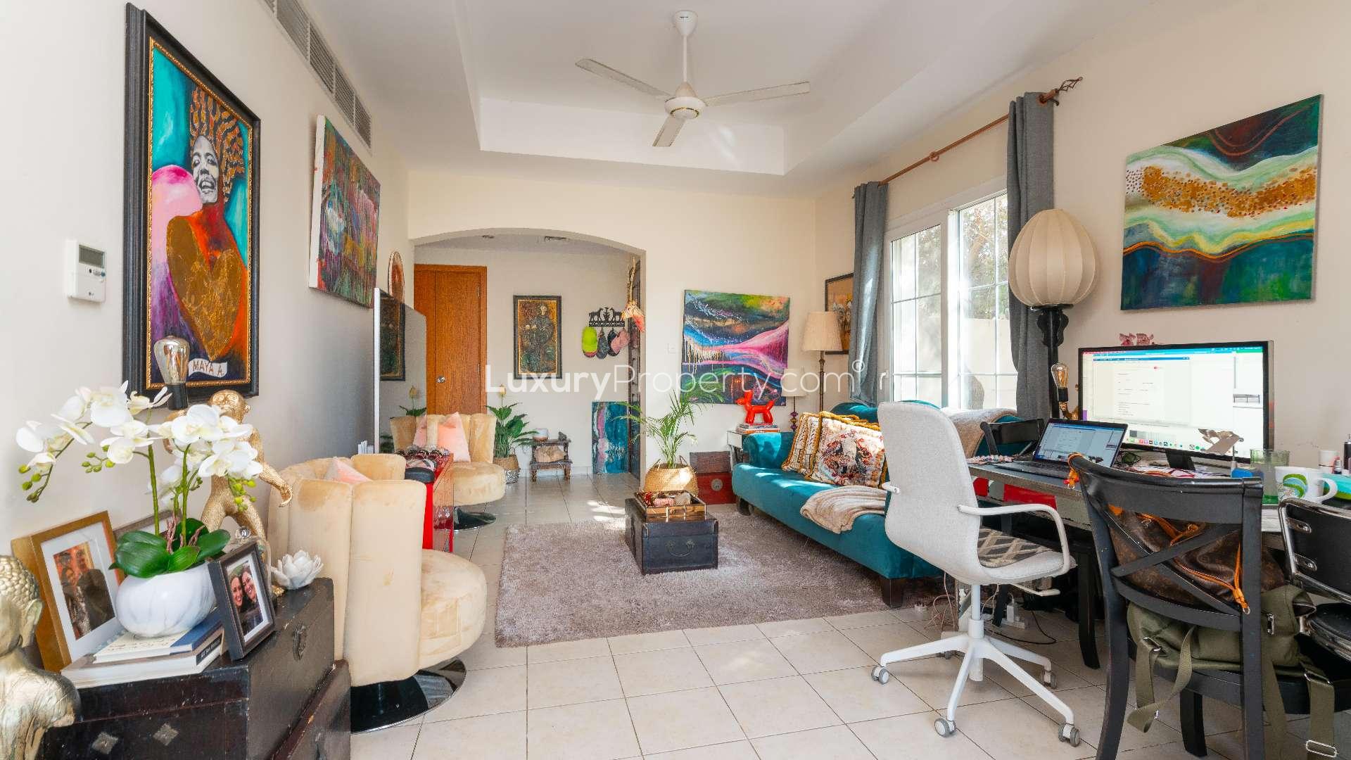 "Spacious garden view of 3-bedroom villa in Al Reem 1, Arabian Ranches for rent.",Living room with colorful decor in 3-bedroom villa, Al Reem 1, Arabian Ranches