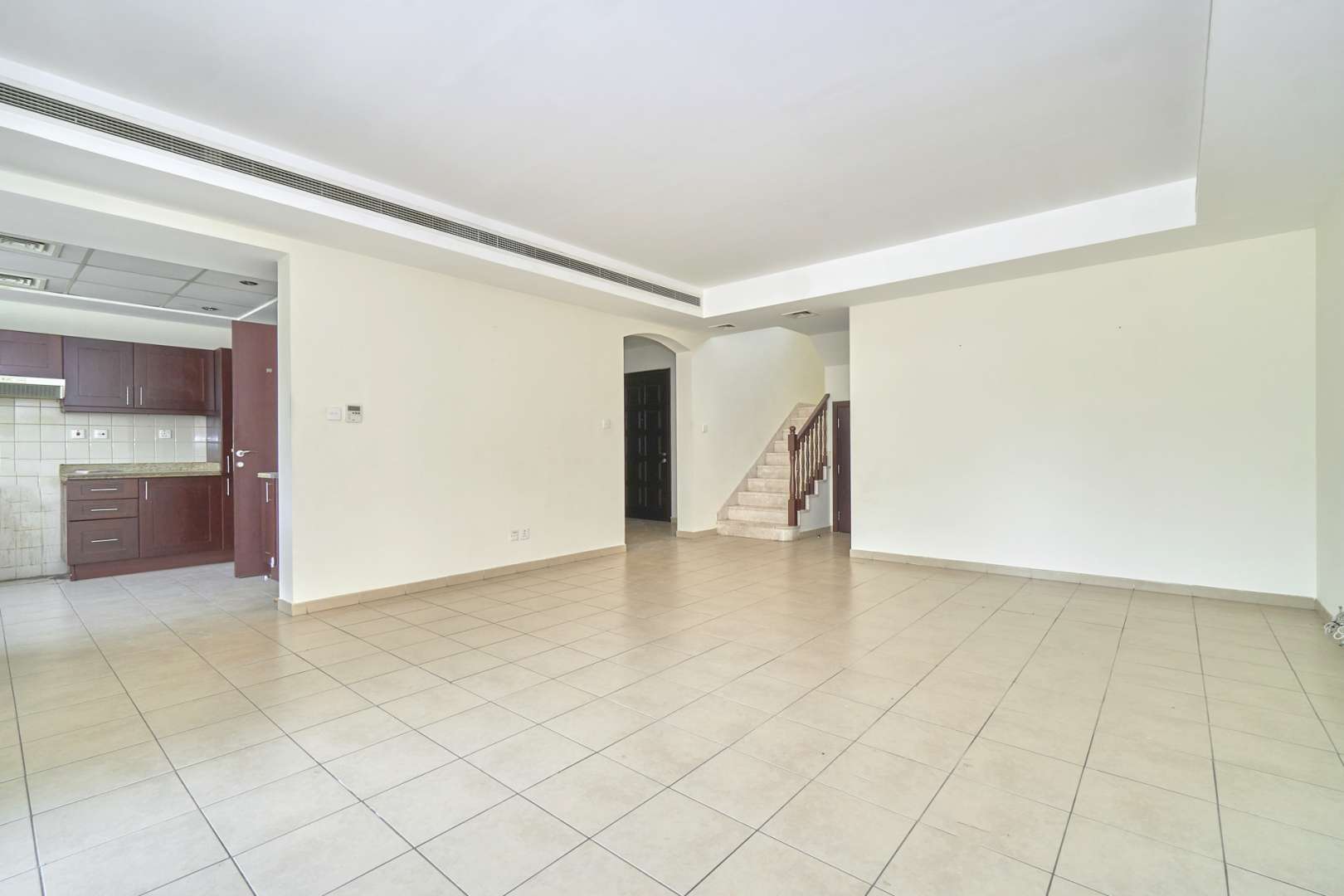 Spacious living room in Al Reem 3 villa, Arabian Ranches, with tiled flooring and natural light