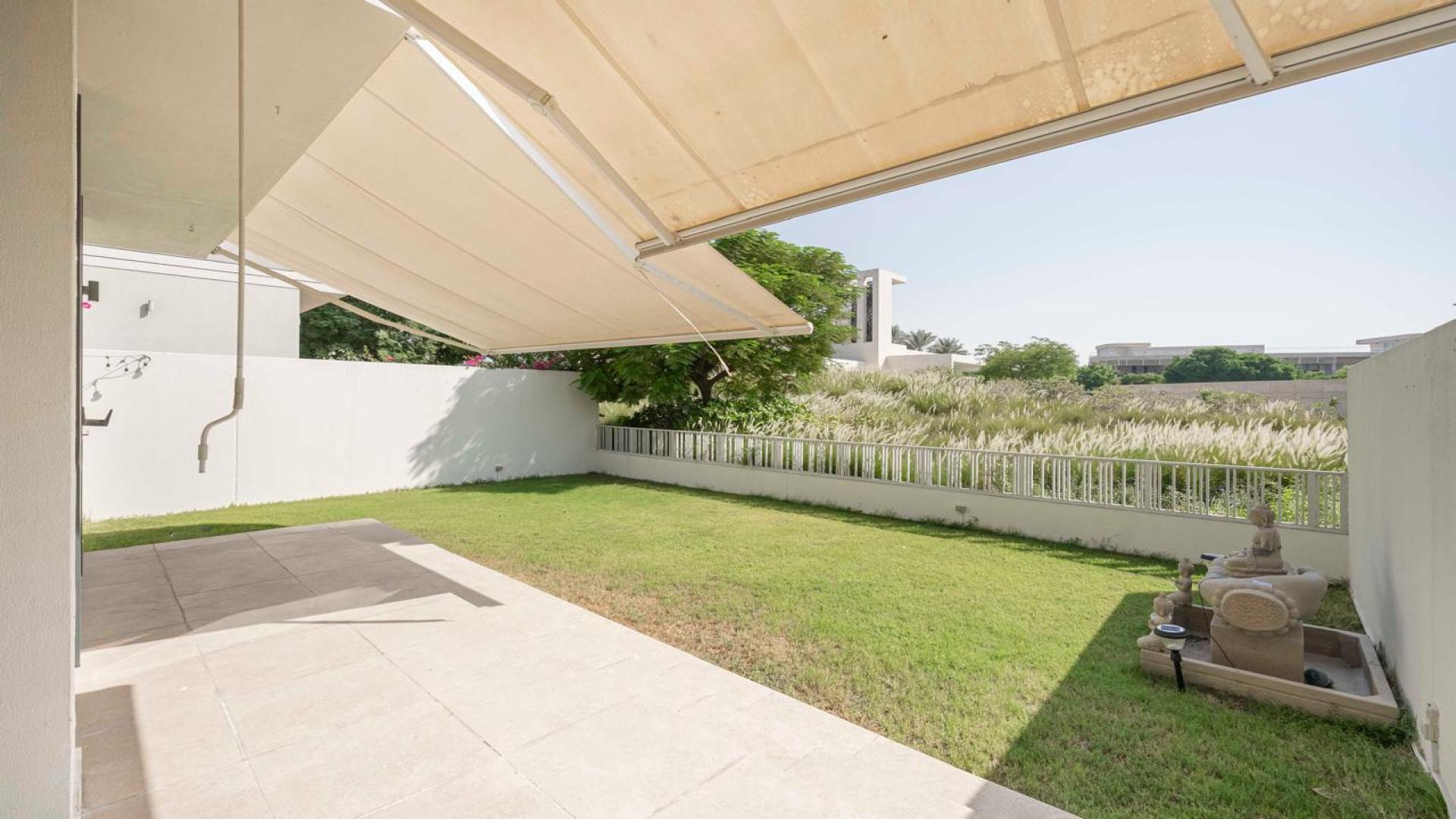 Modern villa exterior with garden at Club Villas, Dubai Hills Estate, available for rent