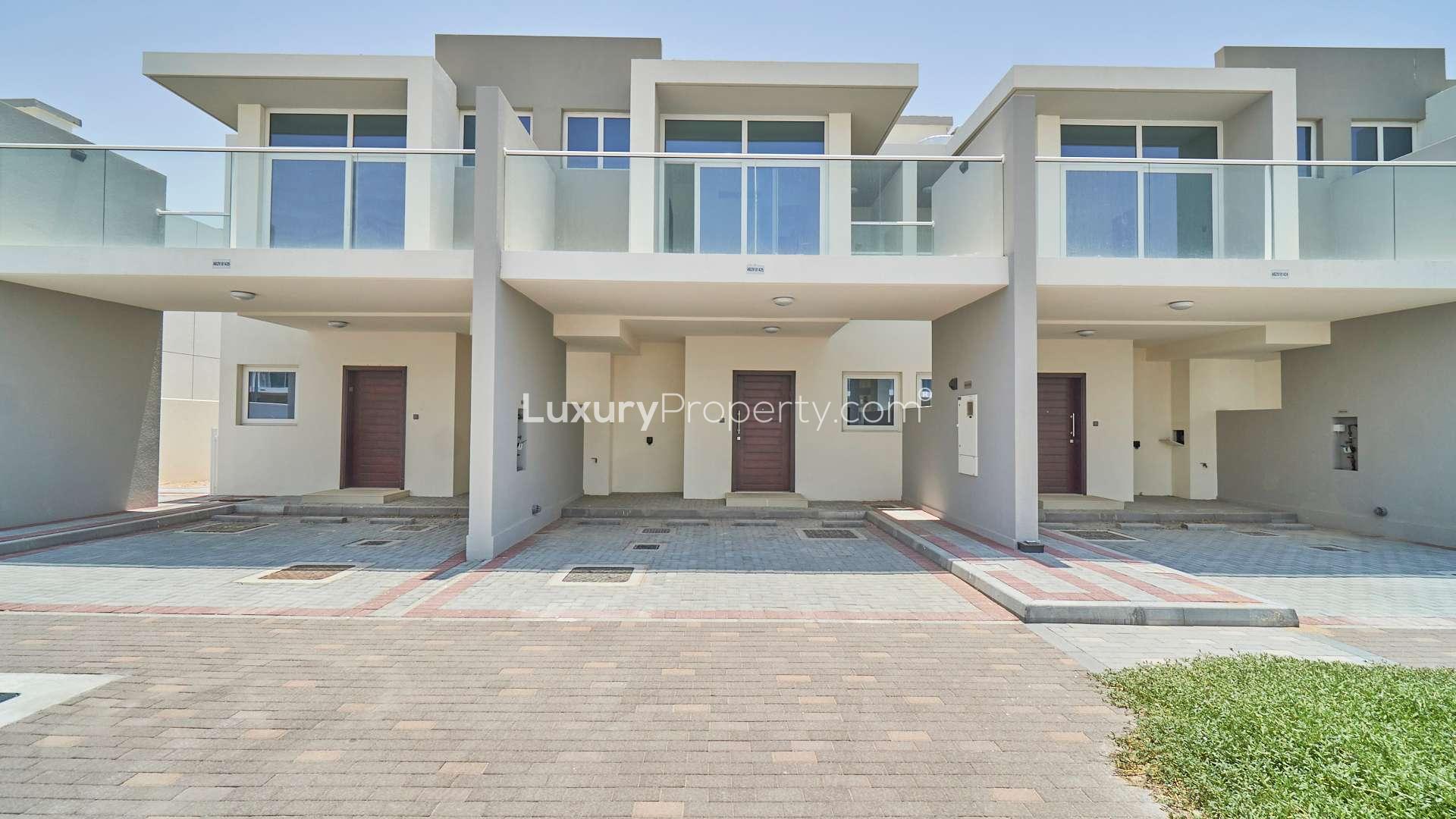 Three-bedroom townhouse interior with patio view in Albizia, Damac Hills 2, for rent