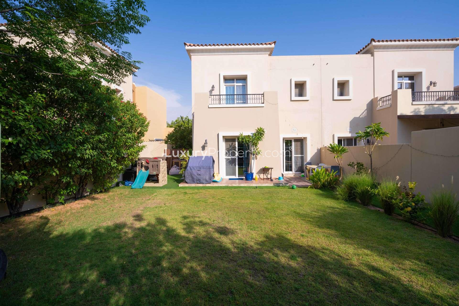 Kitchen in 3-bedroom villa, Alma 1, Arabian Ranches, Dubai, with modern wooden cabinets