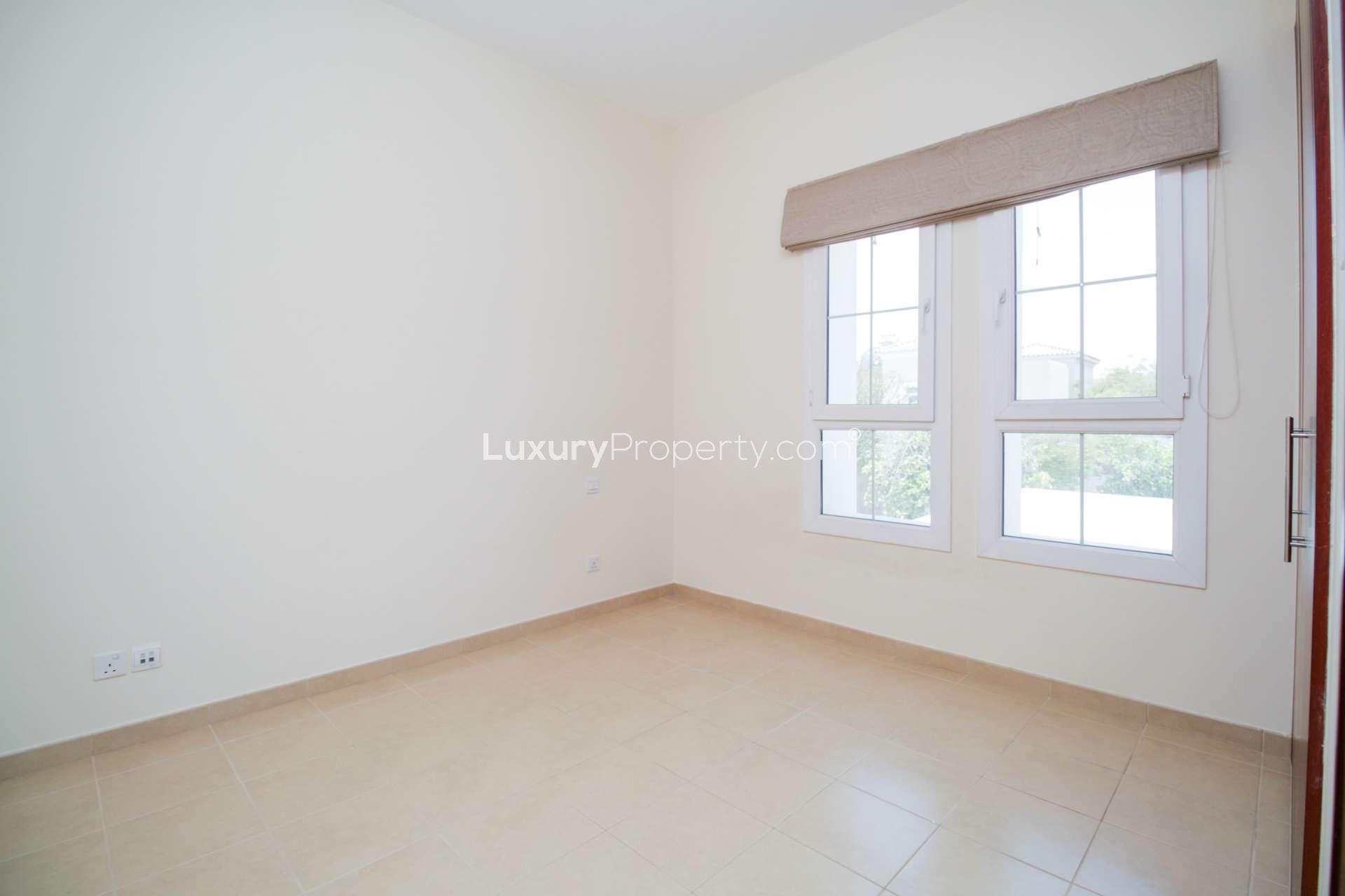 Hallway with wooden doors and staircase in Alma 1 villa, Arabian Ranches for rent