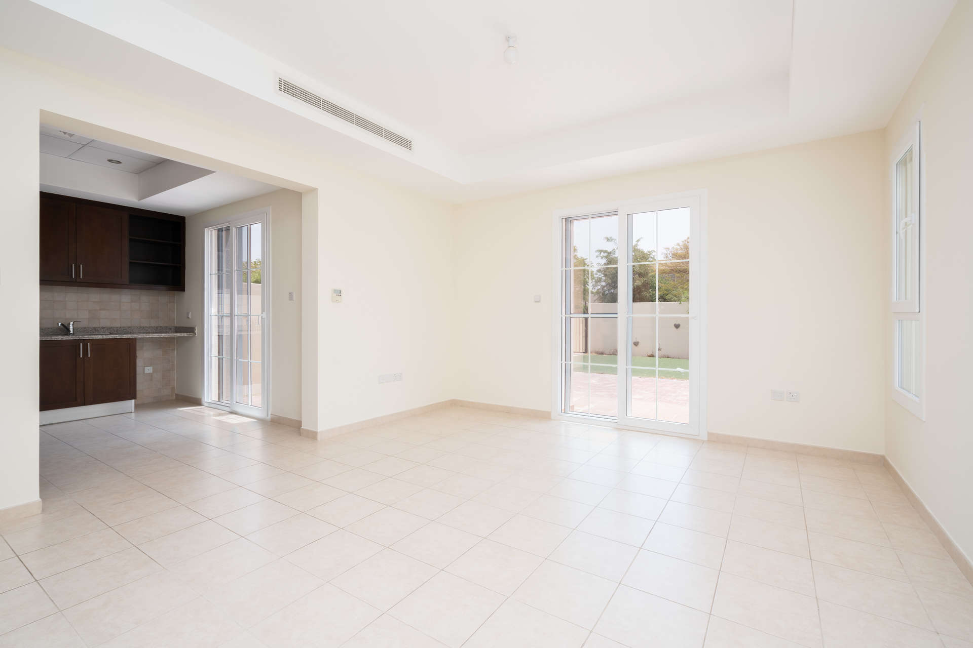 Bright living area with garden view in 3-bedroom villa, Alma, Arabian Ranches