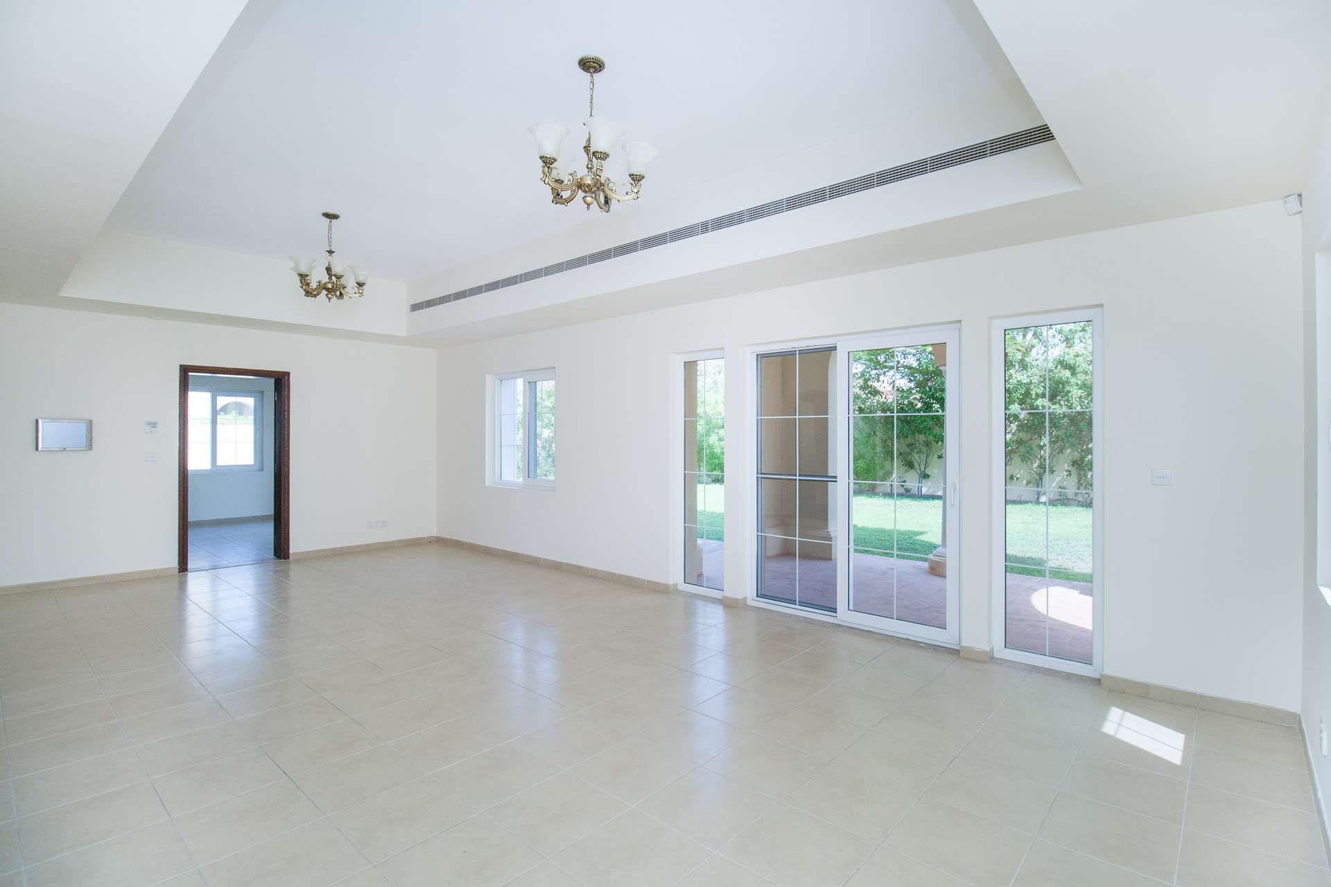 Spacious living room in 3-bedroom A2 villa, Alvorada, Arabian Ranches, with elegant staircase