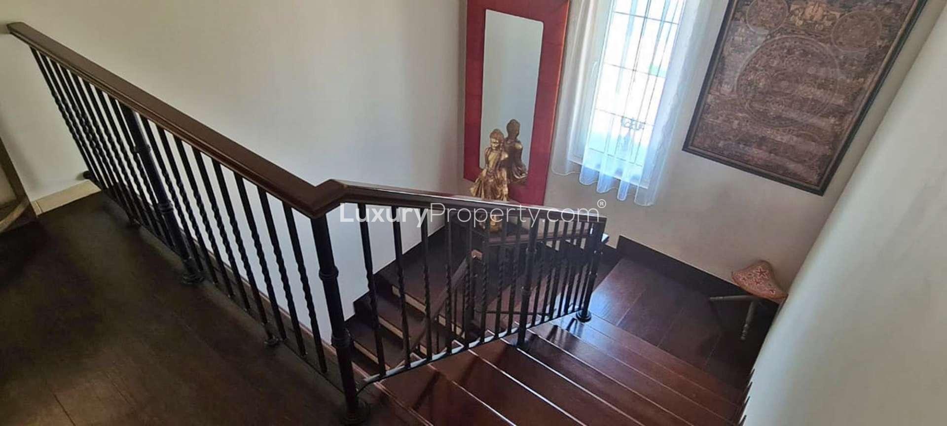 "Modern kitchen and cozy seating area in Alvorada villa, Arabian Ranches, for rent.",Staircase view in spacious A2 Type Villa, Alvorada, Arabian Ranches for rent