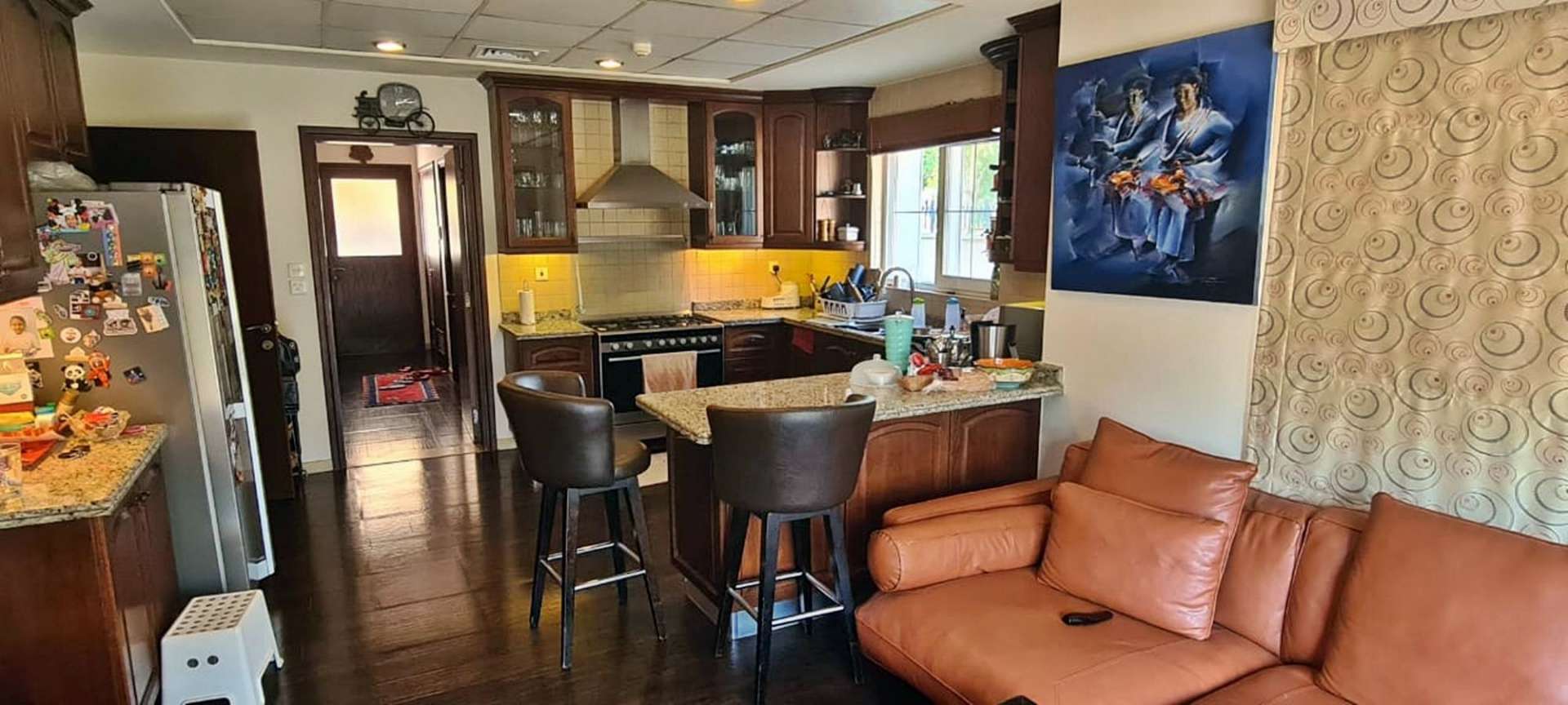 Elegant living room in Alvorada villa, Arabian Ranches with stylish decor and art