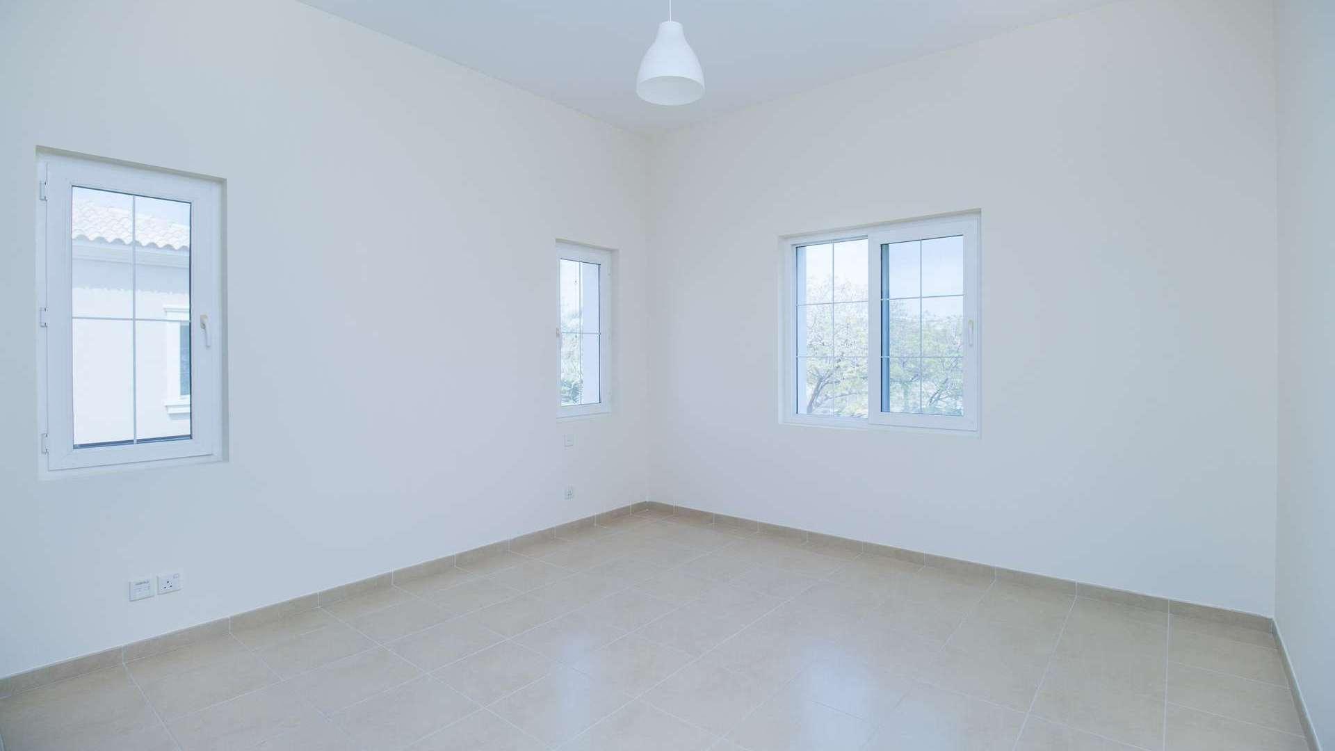 Three-bedroom villa interior in Alvorada, Arabian Ranches, featuring built-in wardrobes and window views