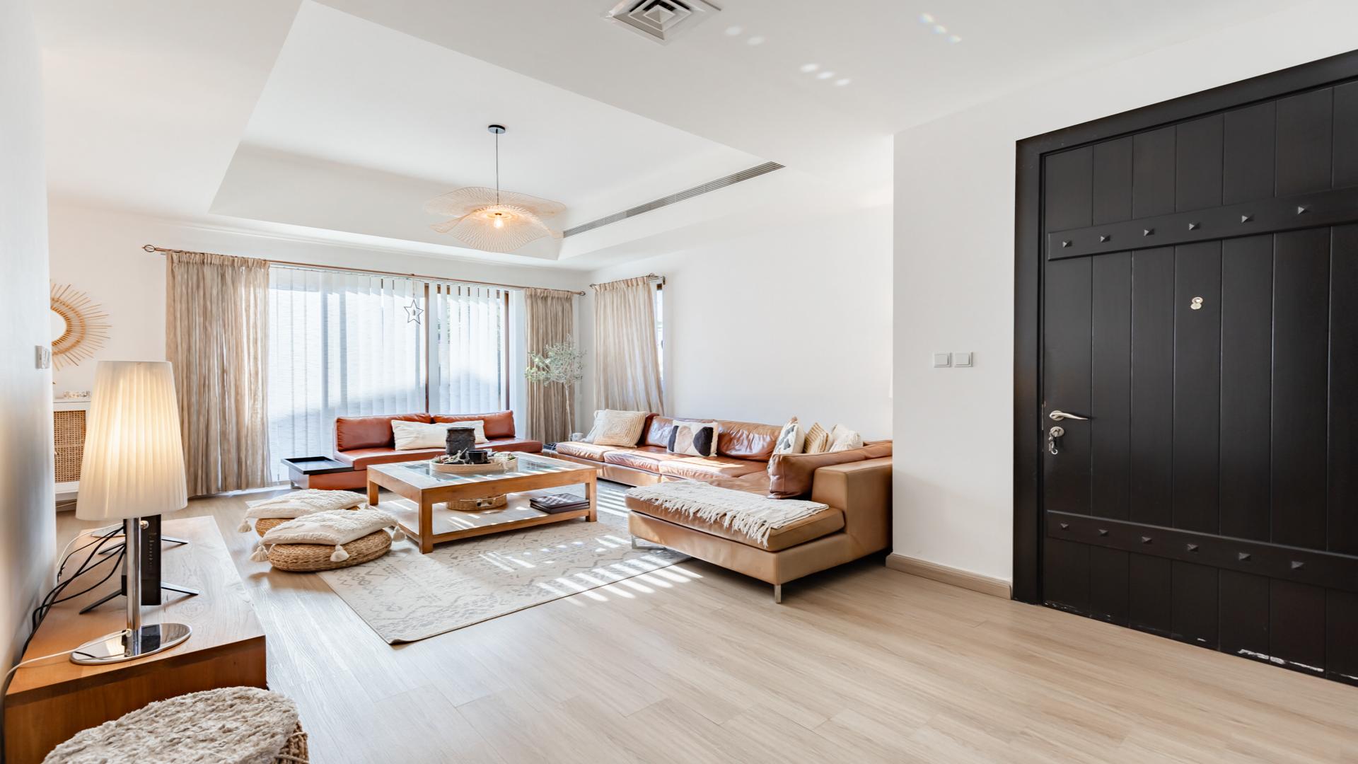 Modern entrance of 3-bed villa in Mira, Reem community, with garden path and plants