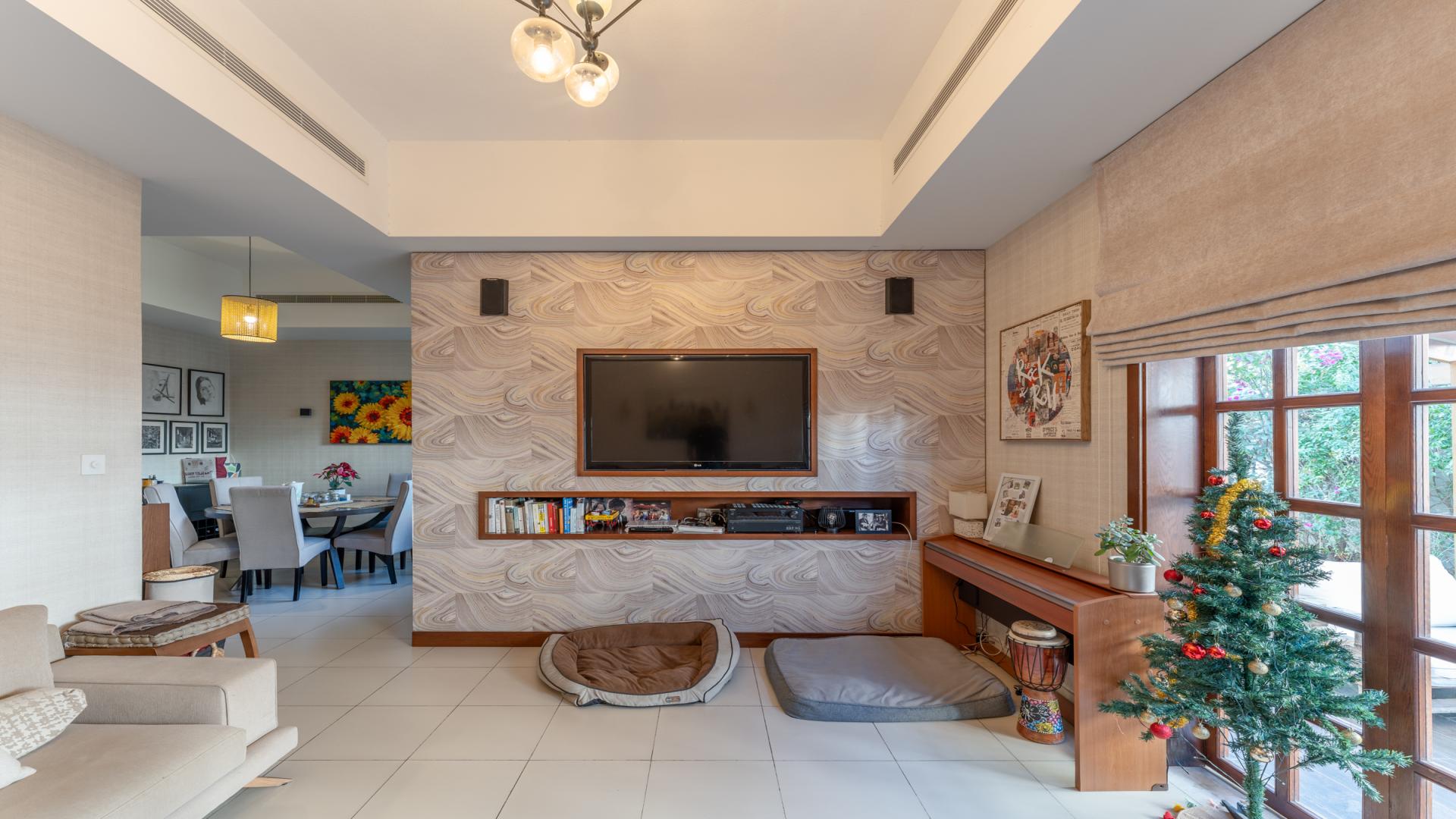 Villa exterior with blooming bougainvillea in Mira, Reem community, ideal family rental retreat