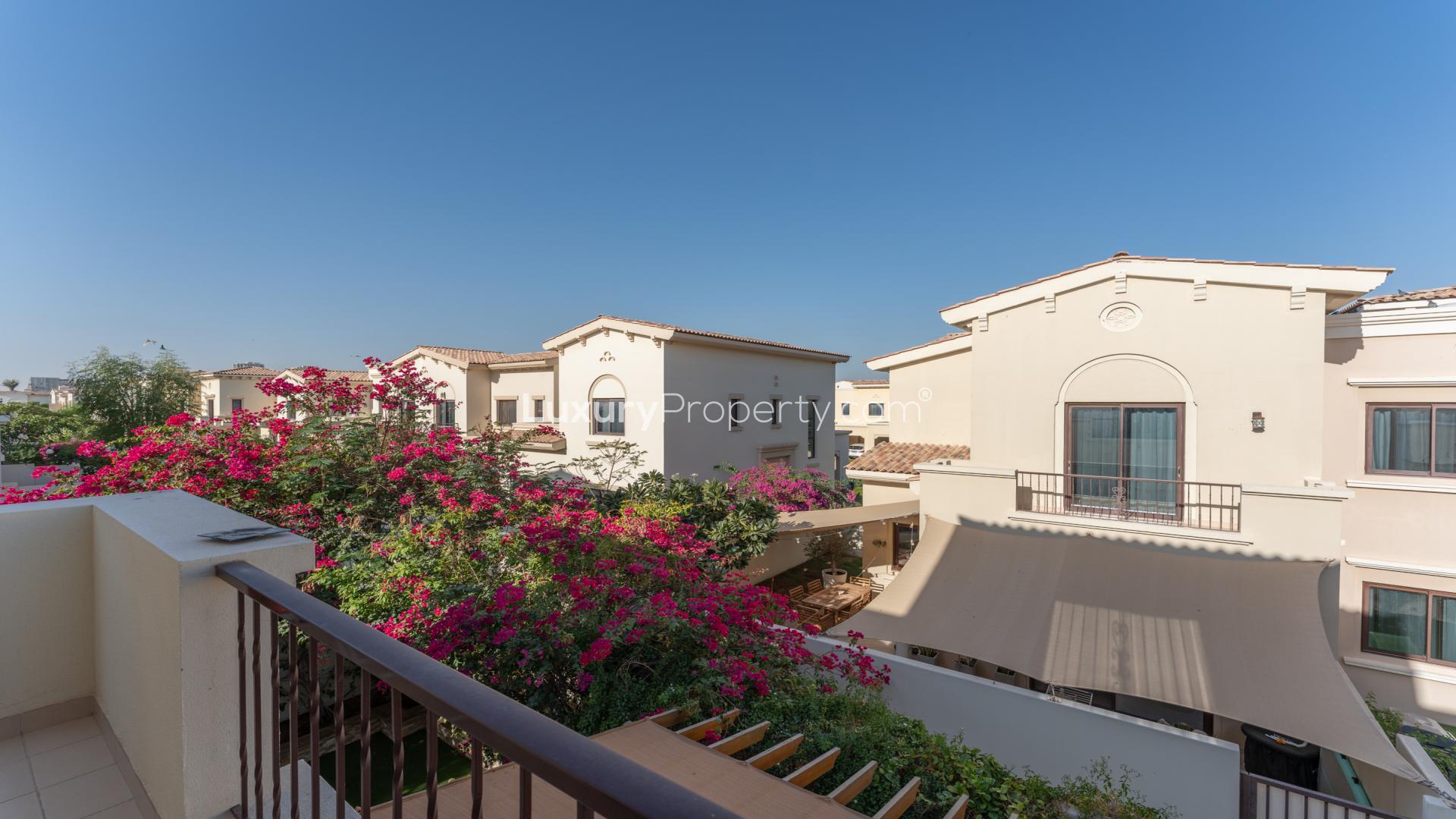 Spacious living room in Mira villa, featuring modern decor and large windows, Reem community